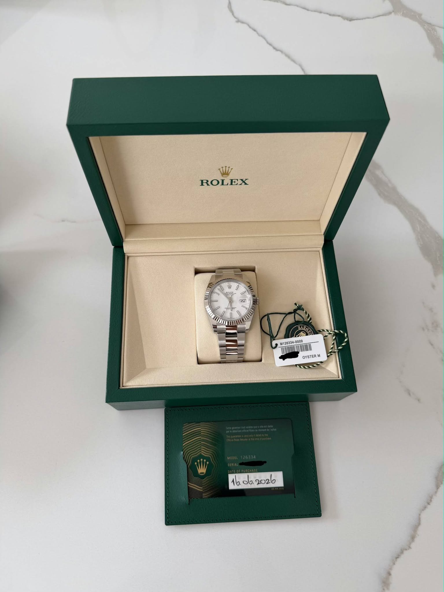 May be an image of wrist watch and text