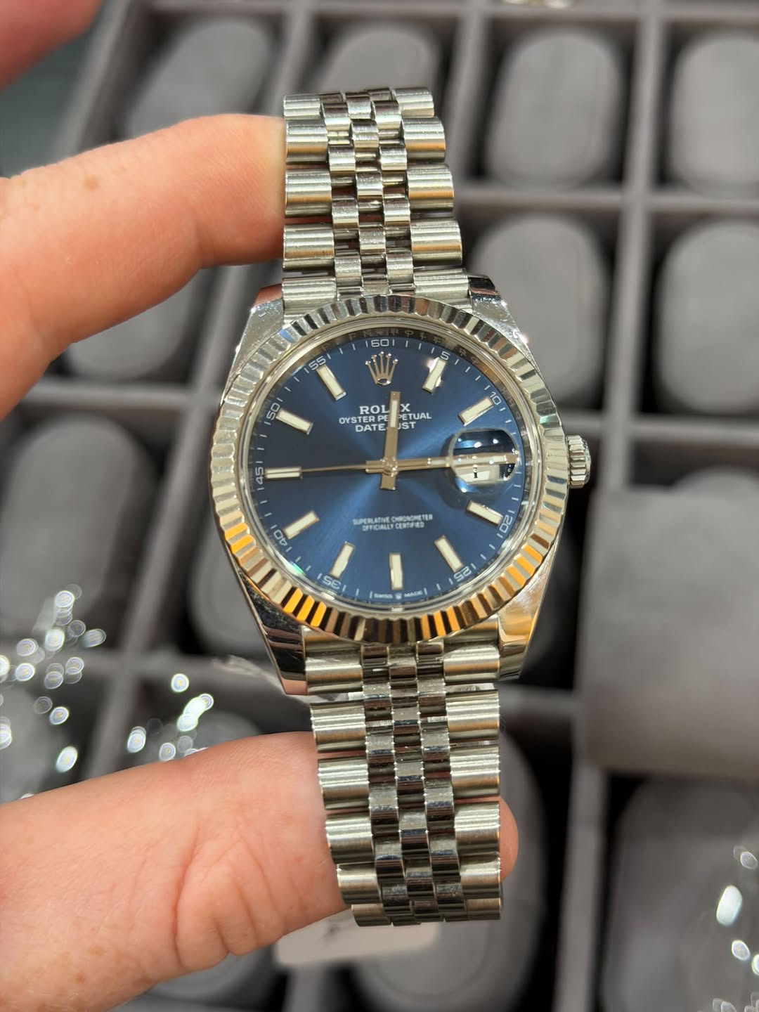 May be an image of wrist watch and text
