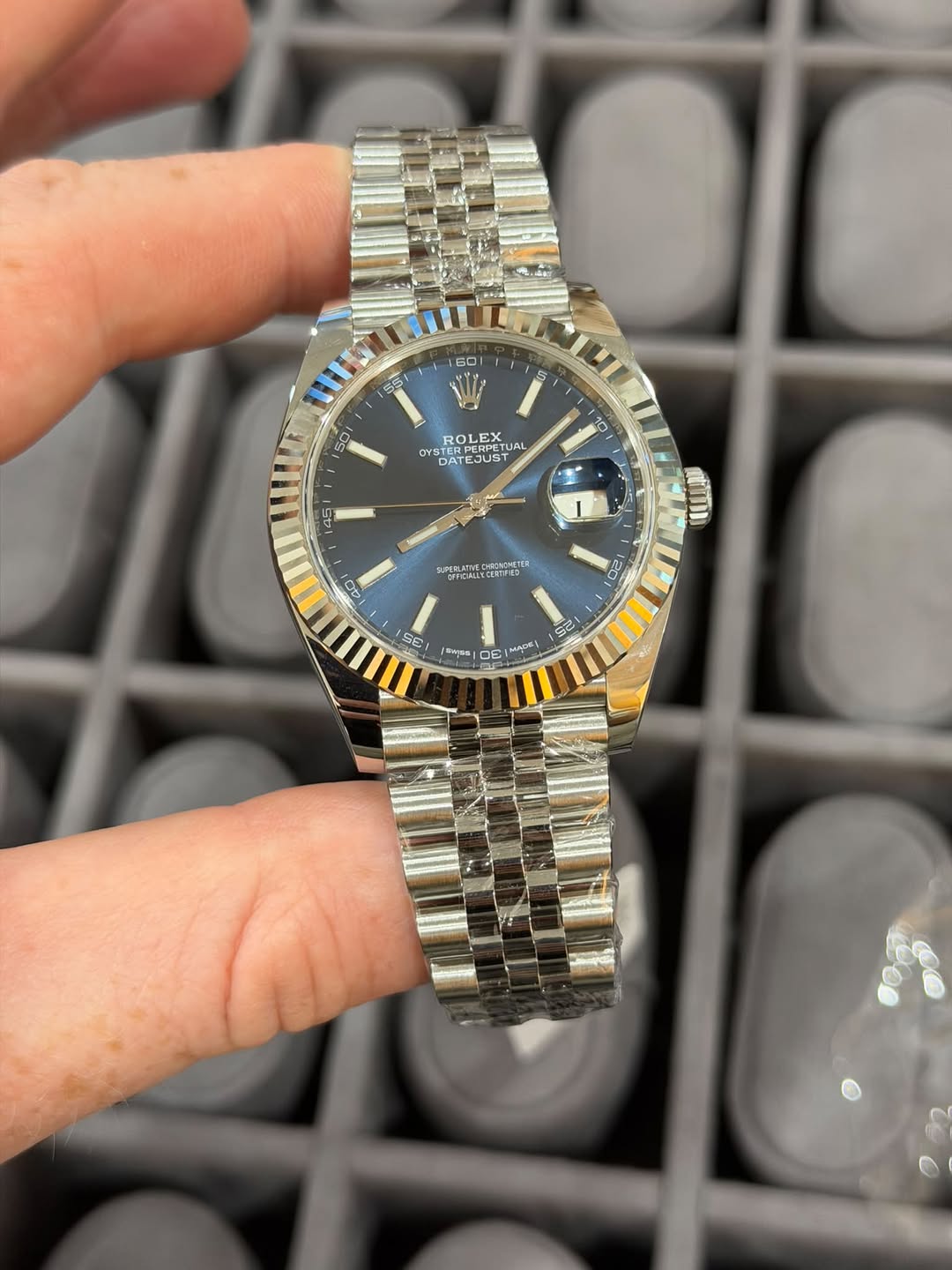 May be an image of wrist watch and text