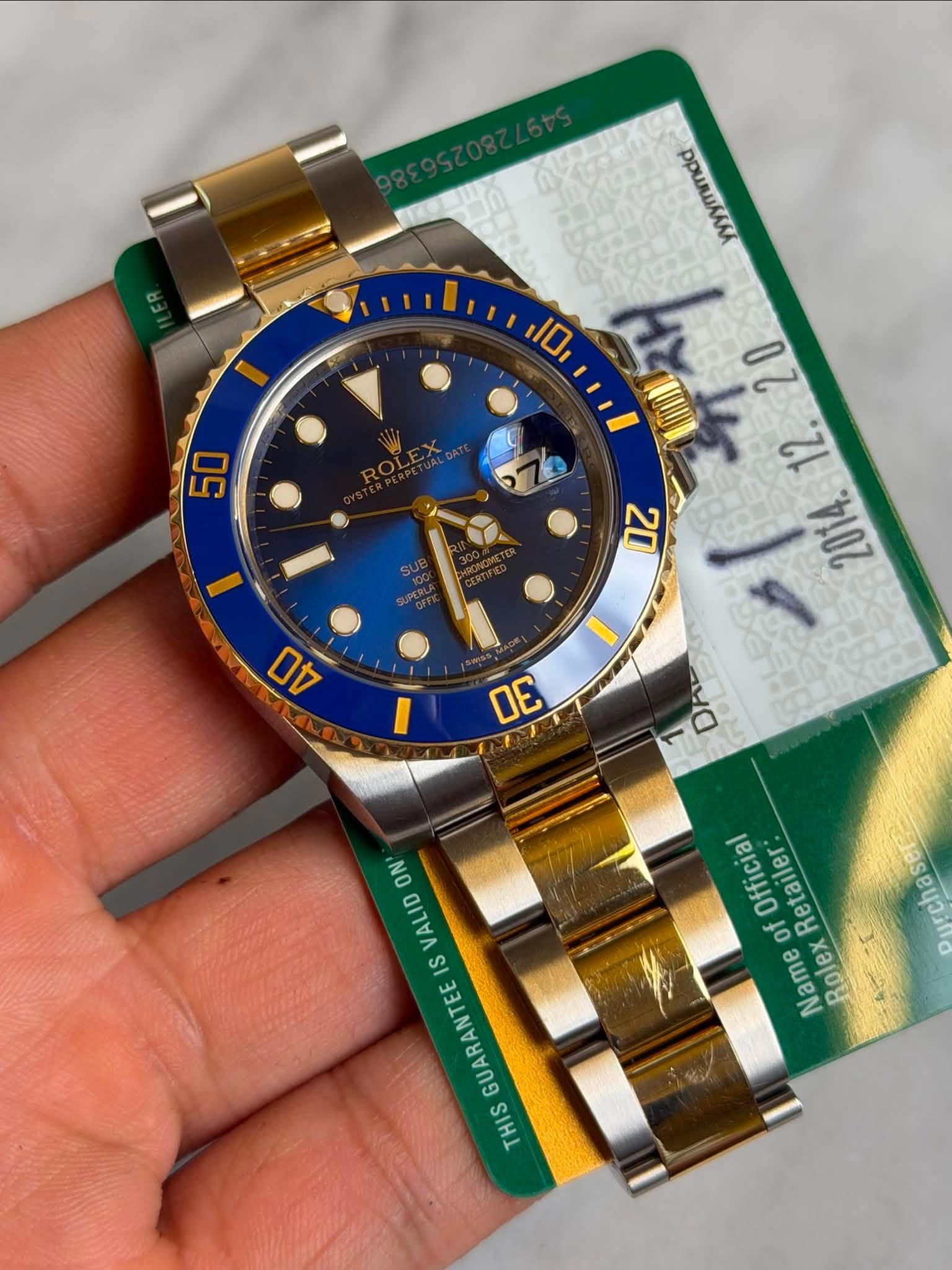 May be an image of wrist watch and text that says 'ppиRwaaлa 10 50 20 نج 20O 2 4D 30 ON VALID IS GUARANTEE THIS Official Retailer: 0 of Ourchase Name olex Rolex M'