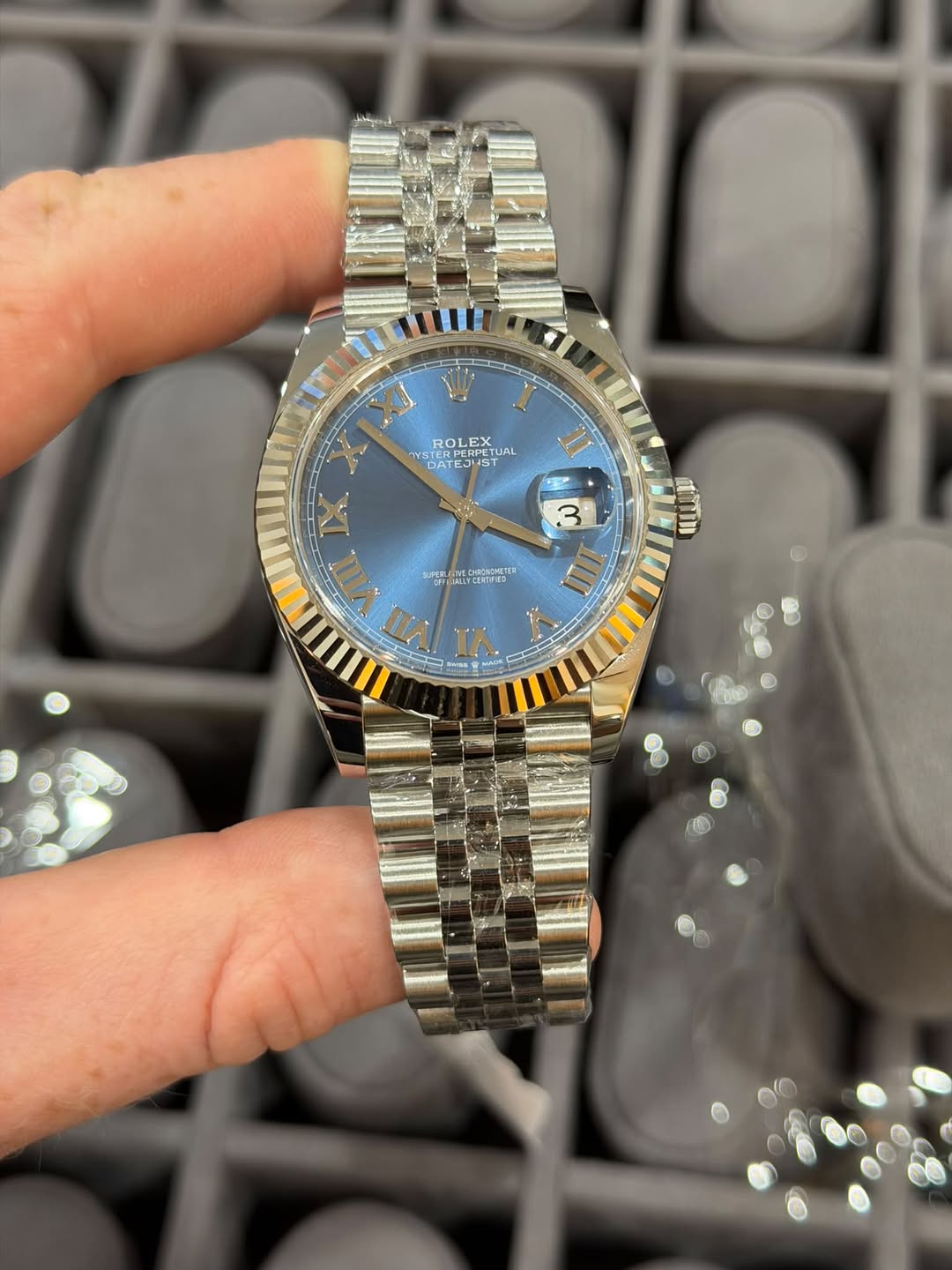 May be an image of wrist watch and text