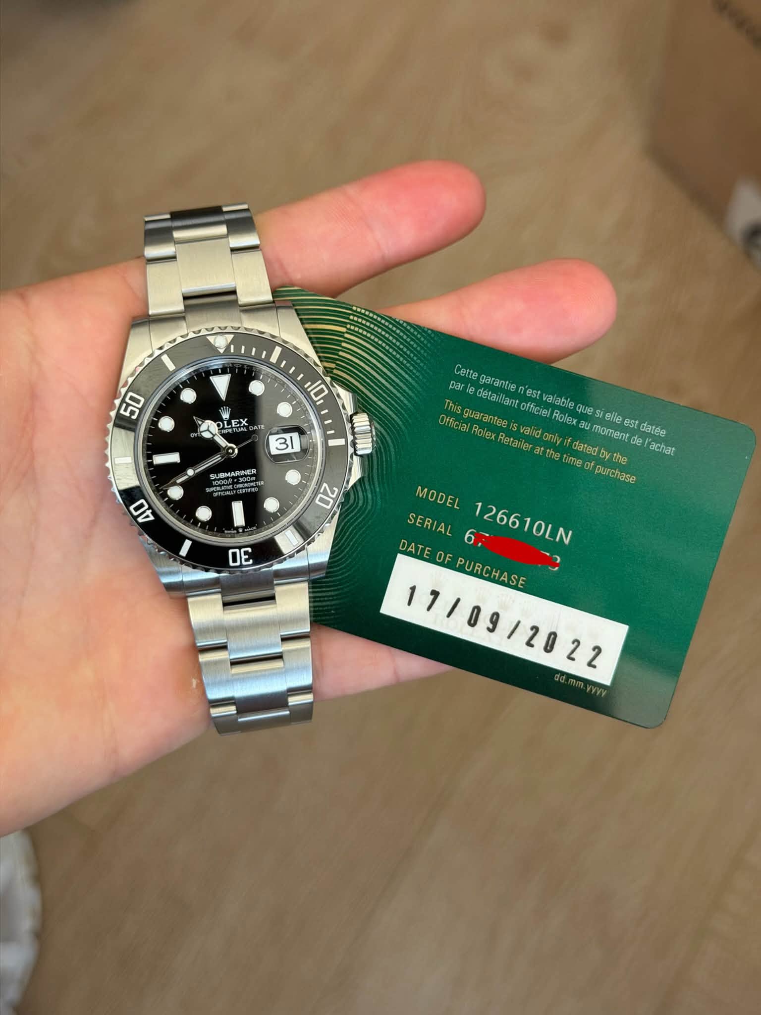 May be an image of wrist watch and text that says '50 10 LEX EX A o 31 UBMARNER HIm 40 Cette garantie estv par détail lant guarantee vali officiel lable Rolex ues elle es…
