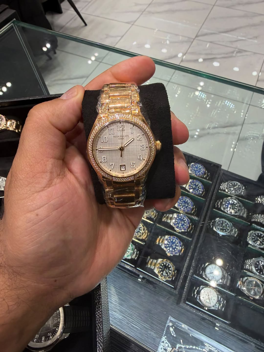 May be an image of wrist watch and text