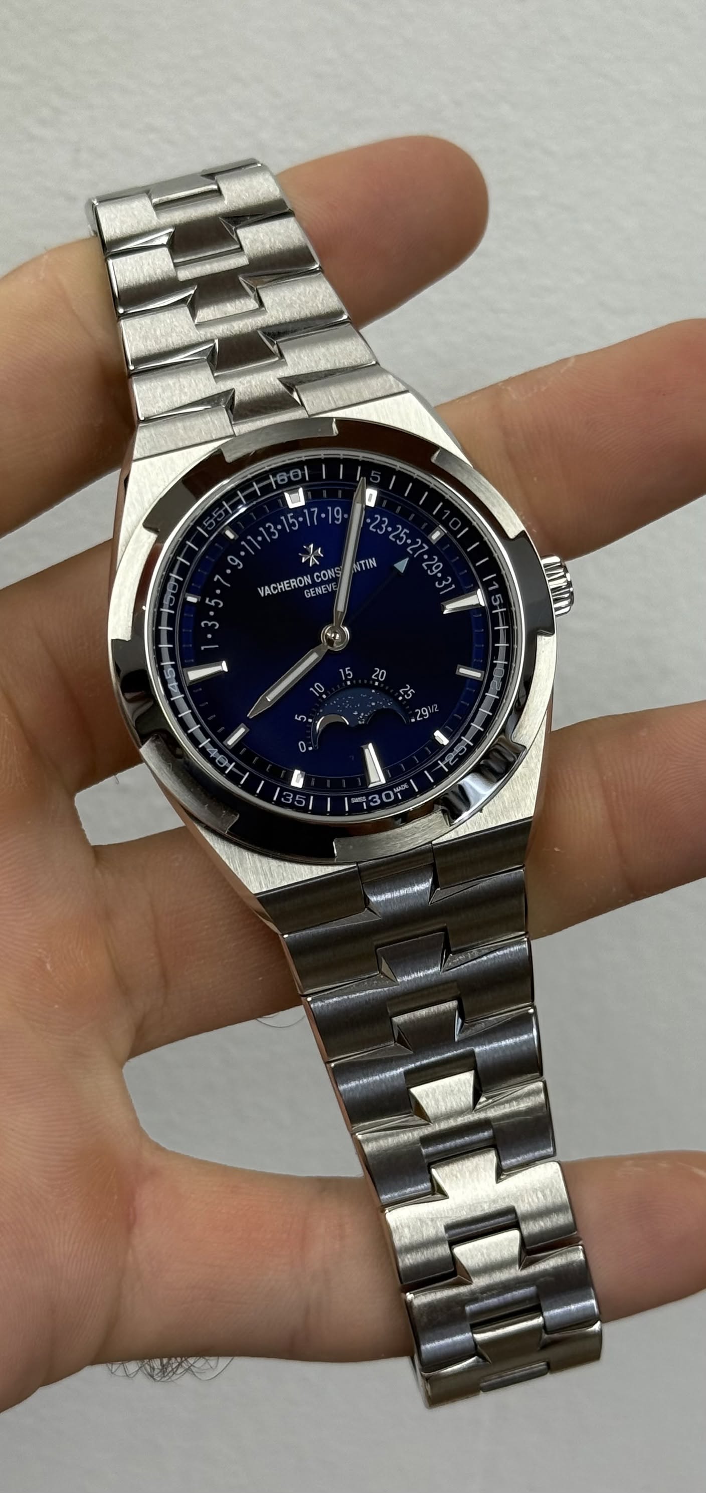 May be an image of wrist watch and text