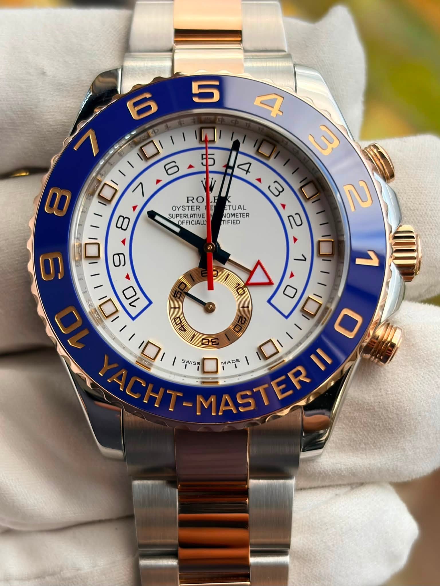 May be an image of wrist watch and text that says '5 6 RO OYSTER SUPERLATIVE OFFICIALL TUAL NOMETER MFIED पा। ١0 I 6 7 ا|١ ١ 9 8 II ים 10 LInM 4 ロ 口 SWISS 口 DE MADE I'
