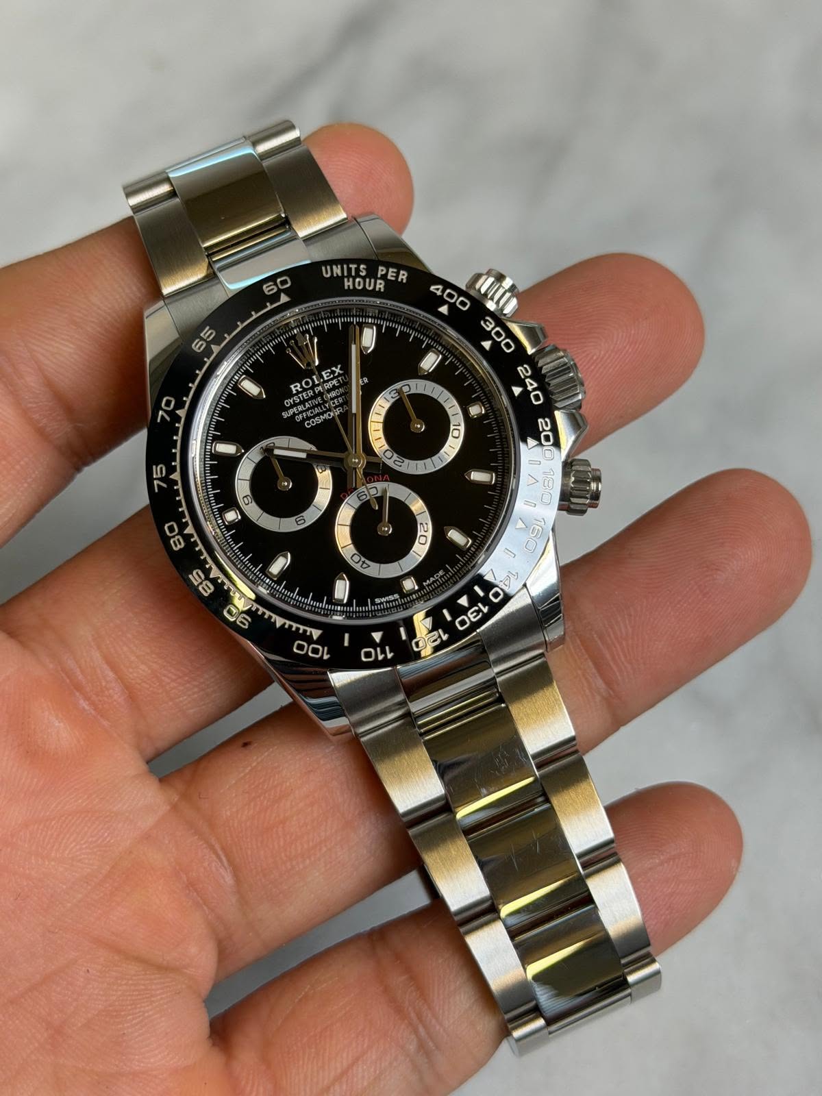 May be an image of wrist watch and text