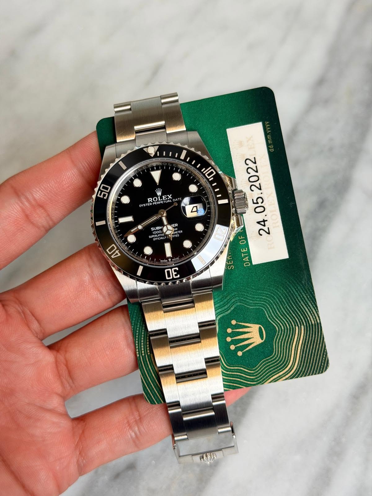 May be an image of wrist watch and text that says '0 50 ROL ROLEX OL EX YST 4 SUBM SUe N OREER ผุด AN . DATEOF OF DE 有を称'