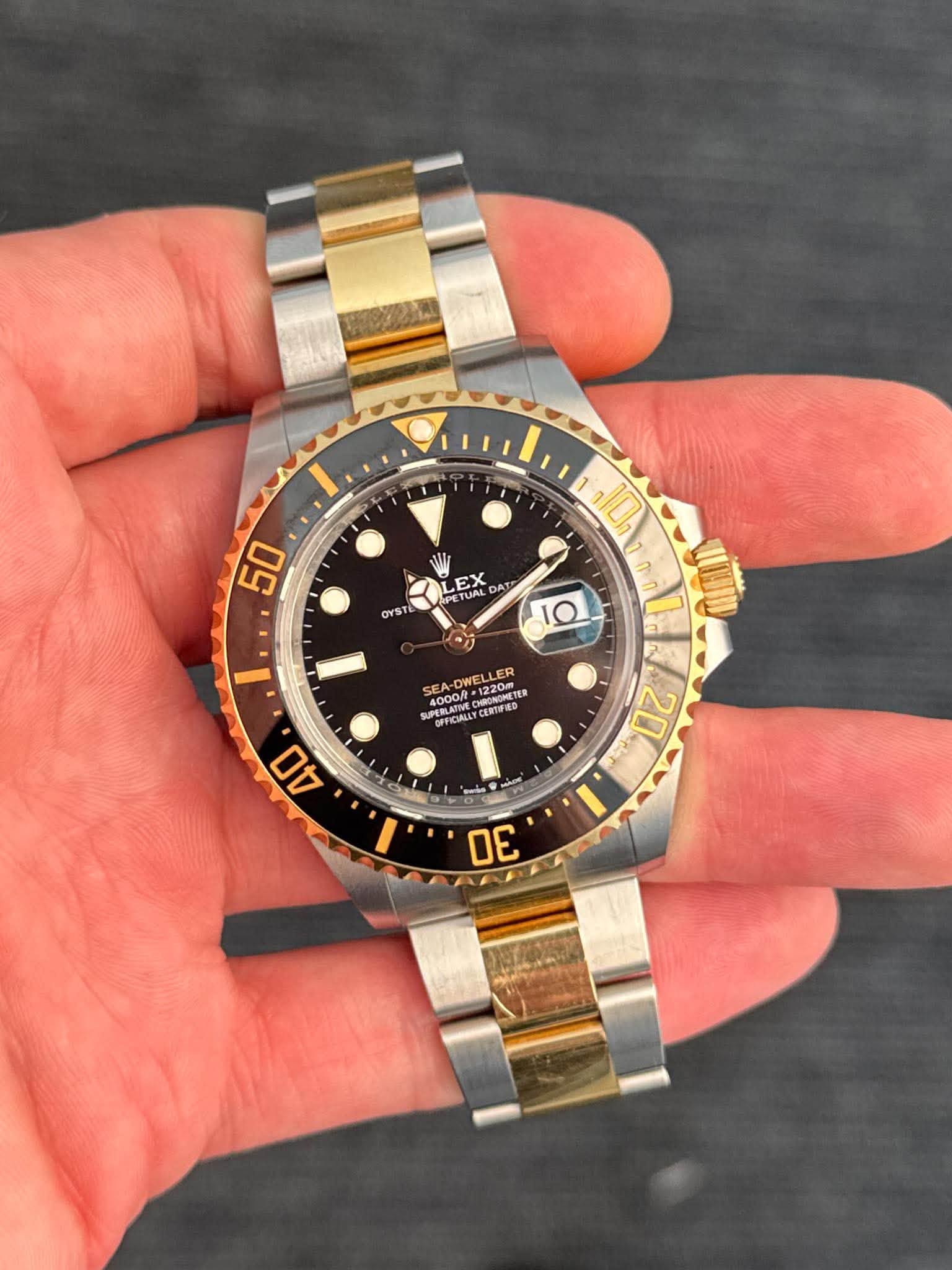 May be an image of wrist watch and text