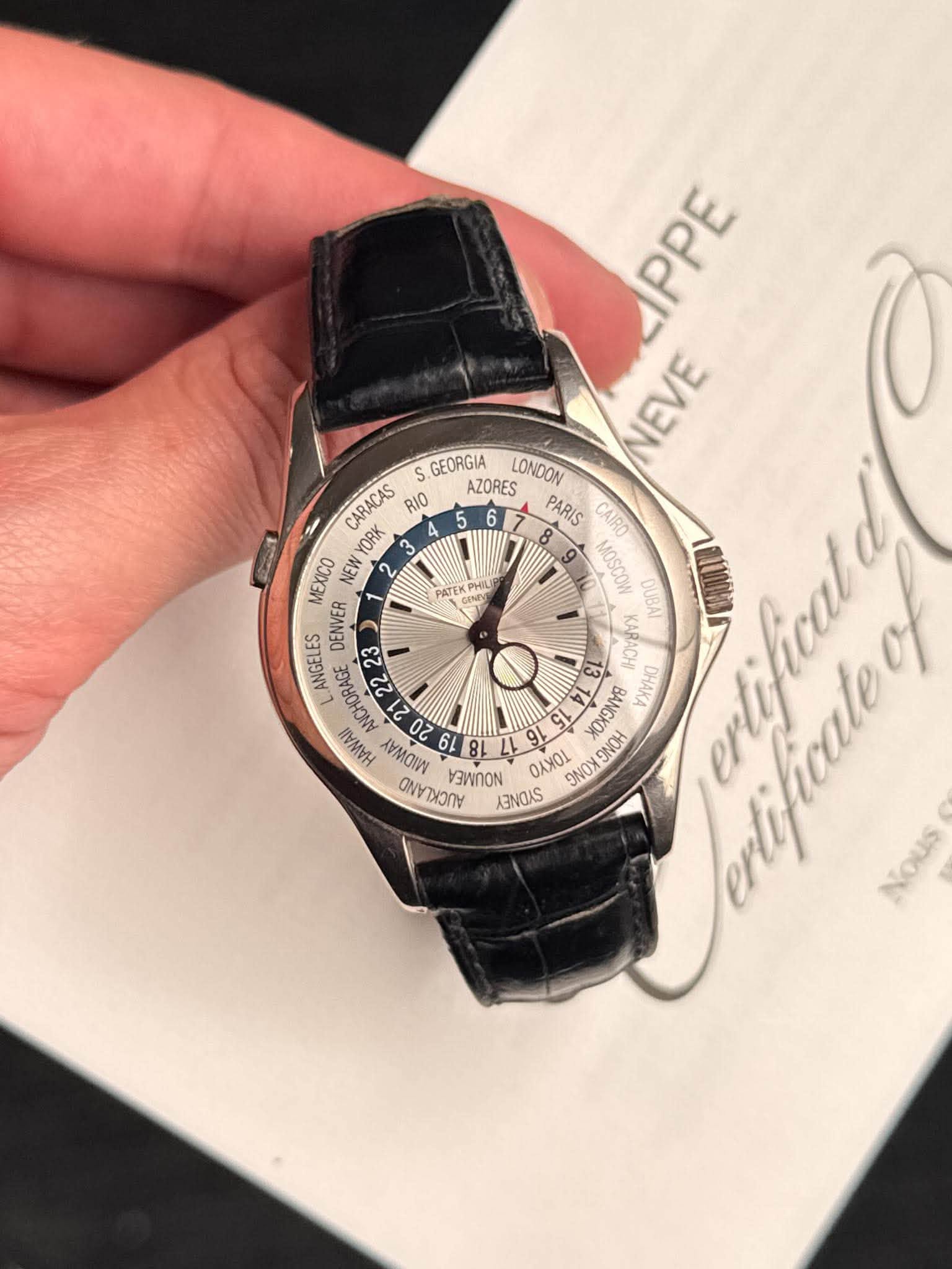 May be an image of wrist watch and text