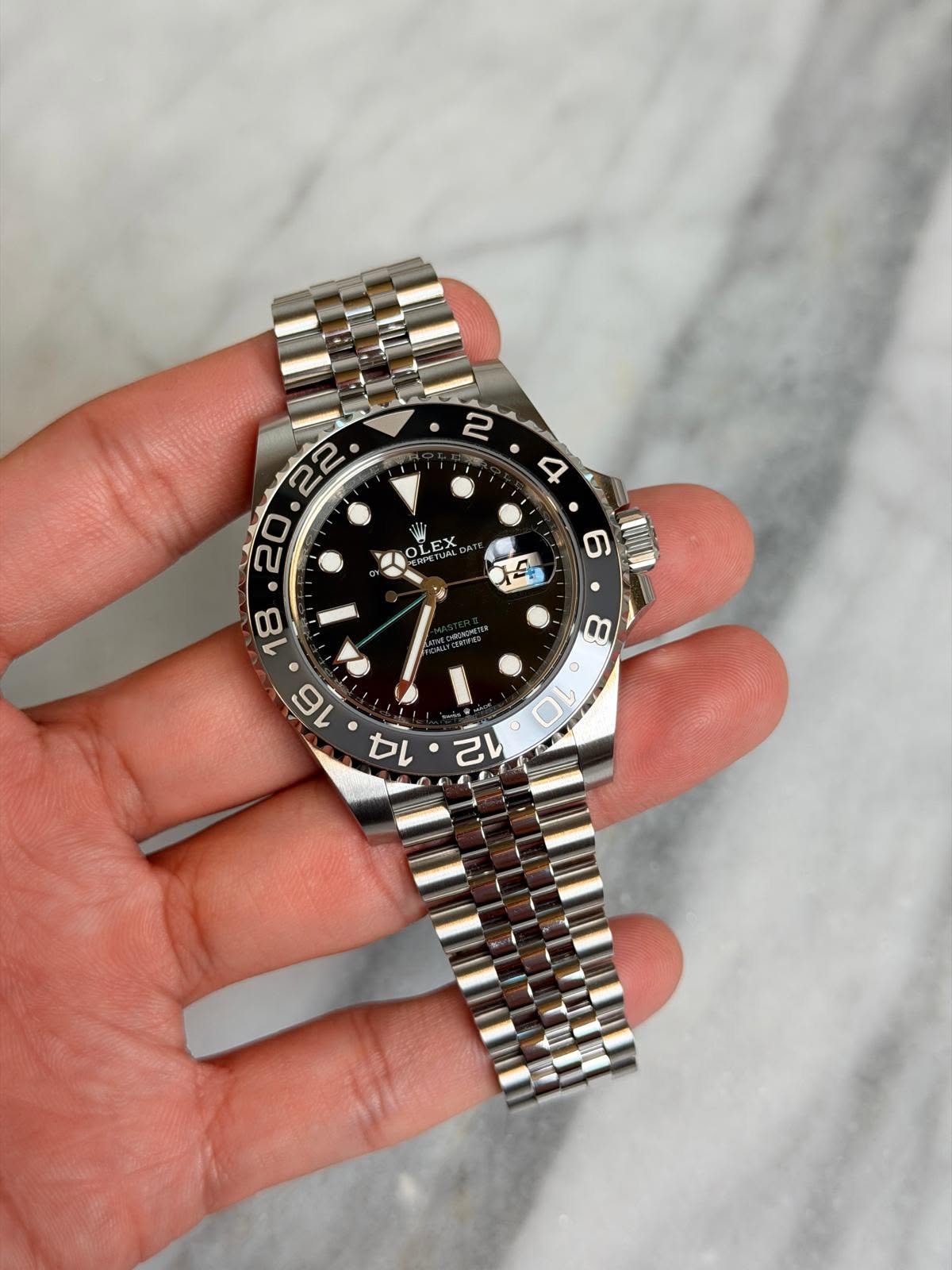 May be an image of wrist watch and text