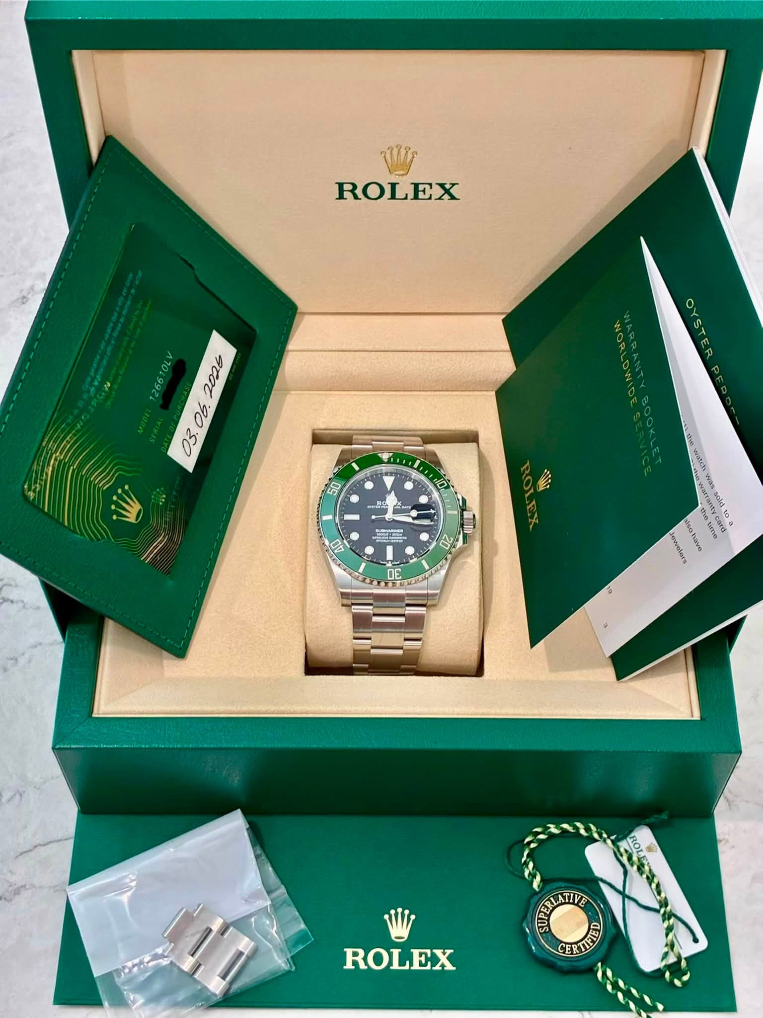 May be an image of wrist watch and text that says 'Wy ROLEX . O6. 03. 50 کا H - PUSS 보드 07 20 DE hetre ewelers ROLEX ERTIFED'