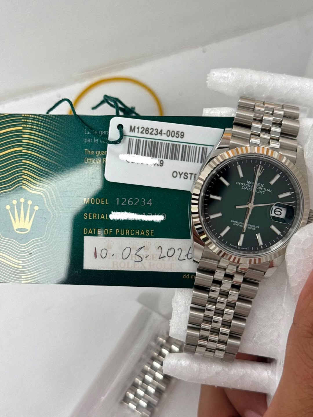May be an image of wrist watch and text