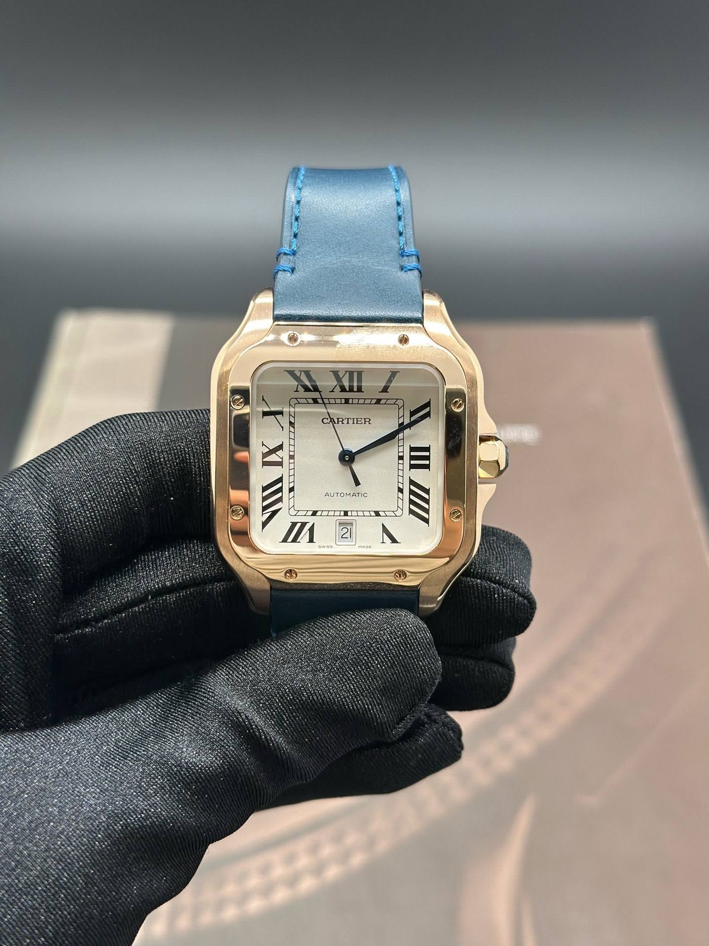 May be an image of wrist watch, leather and text