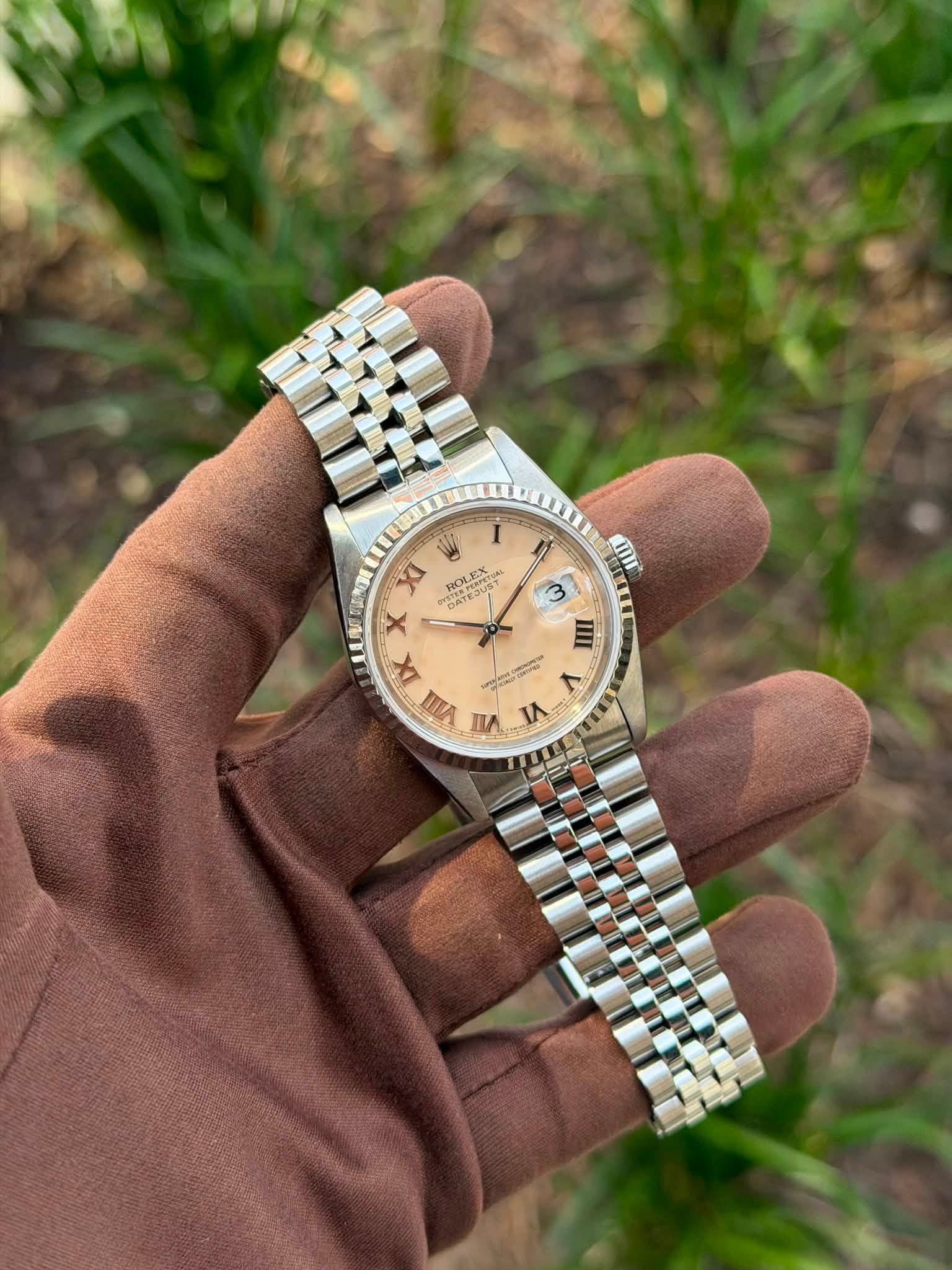 May be an image of wrist watch and text