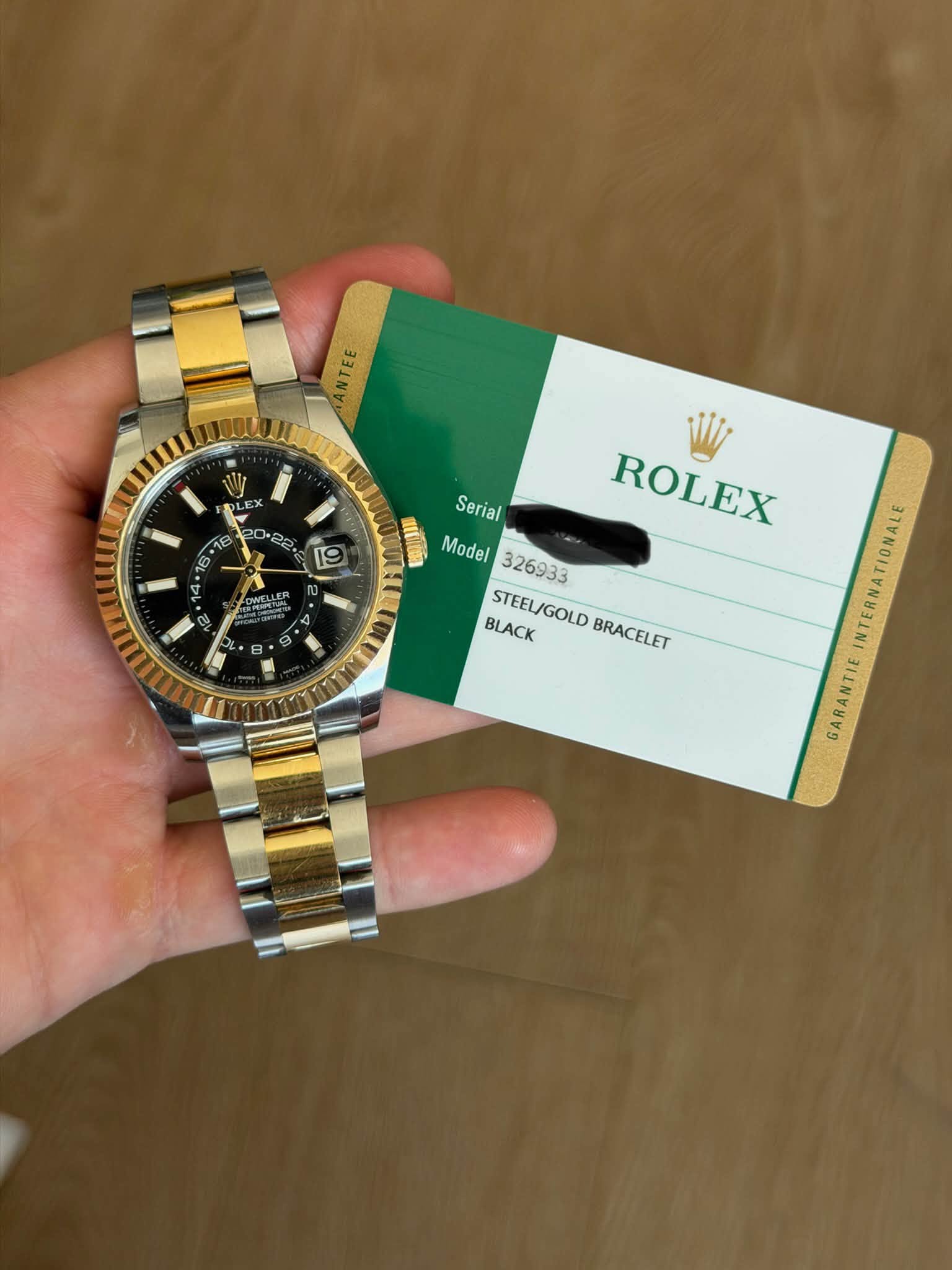 May be an image of wrist watch and text that says 'ANTEE W EN EX 18 קי0 cu 19 9 ល * 자작 N Serial ROLEX Model326933 Model 326933 BLACK STEEL/GOLD BRACELET NTERNATIONALE…
