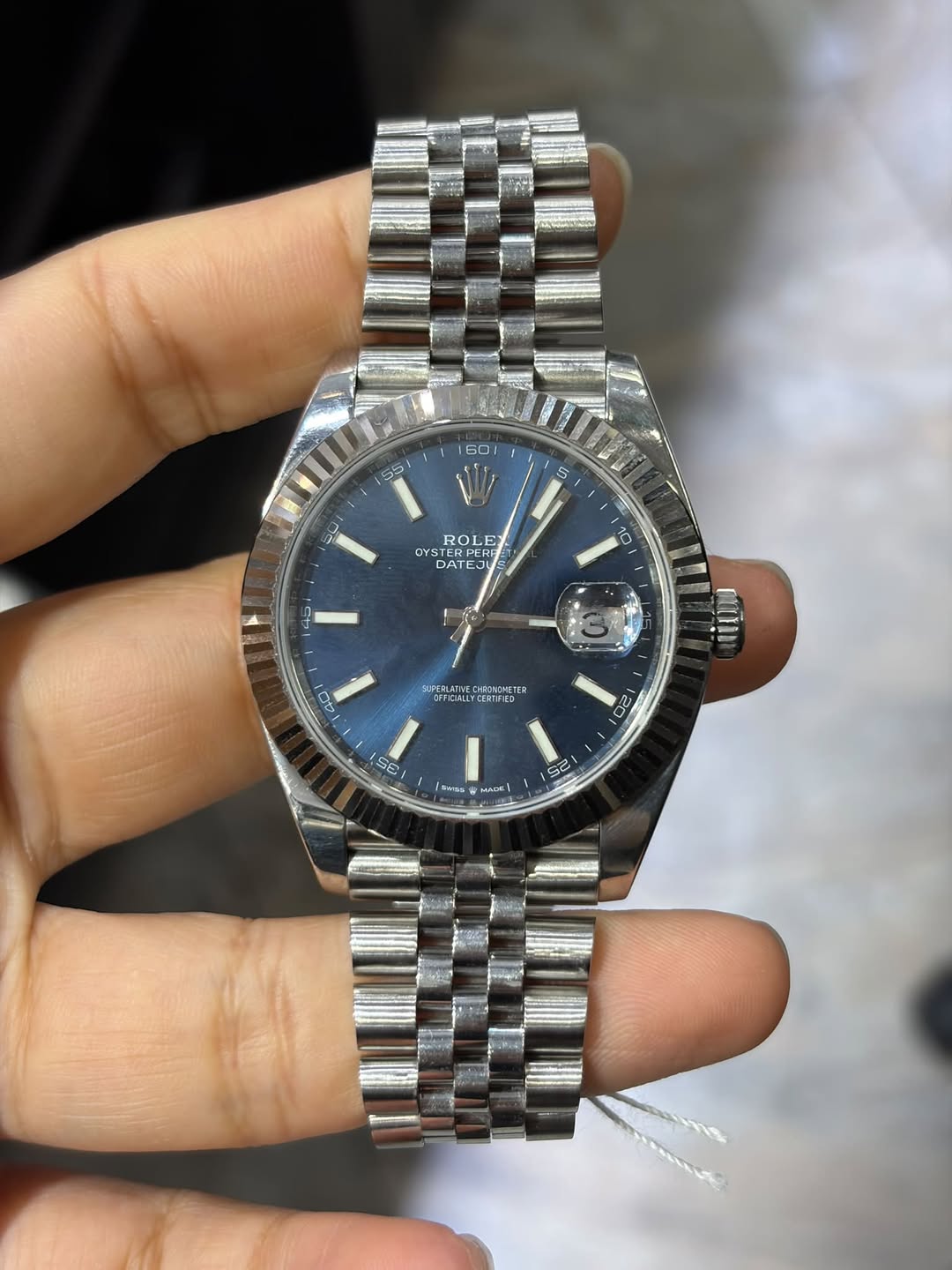 May be an image of wrist watch and text