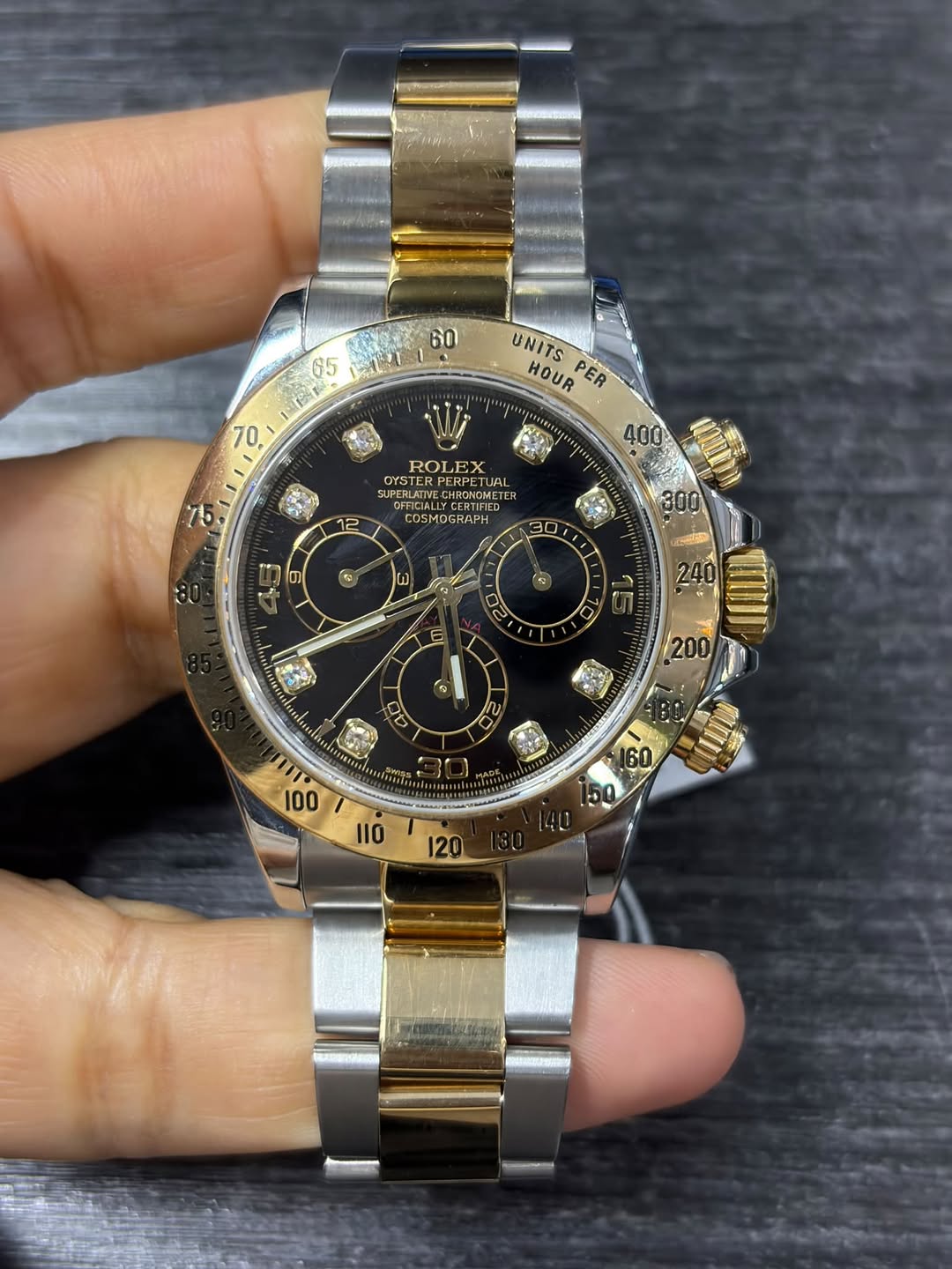 May be an image of wrist watch and text