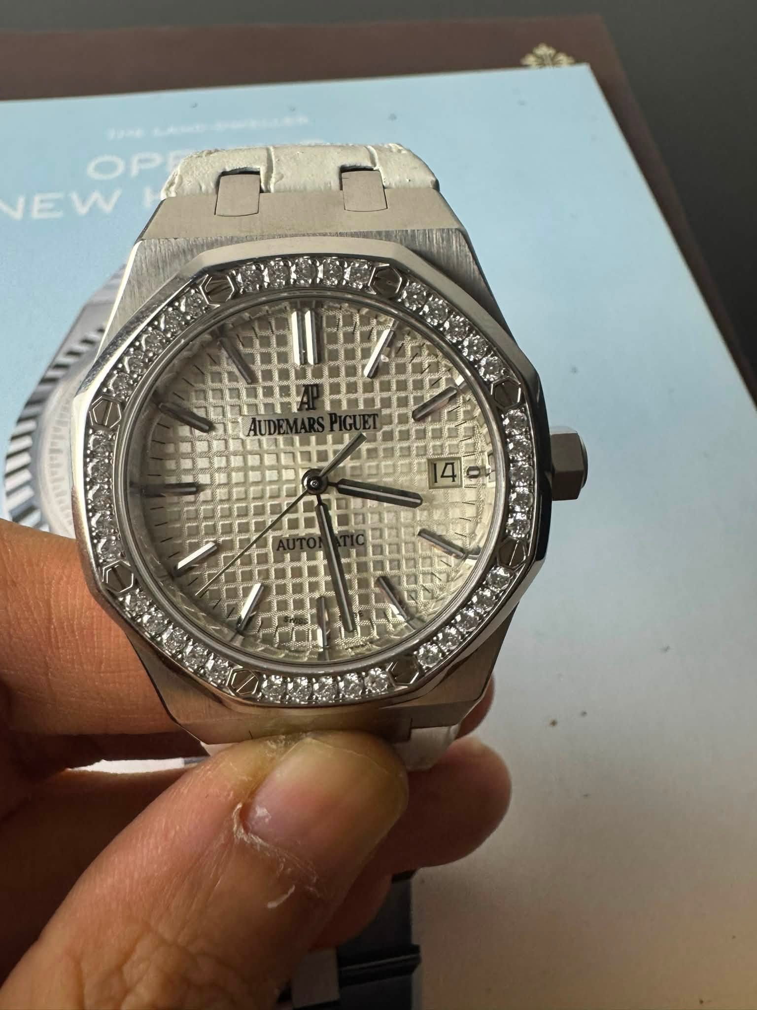 May be an image of wrist watch and text