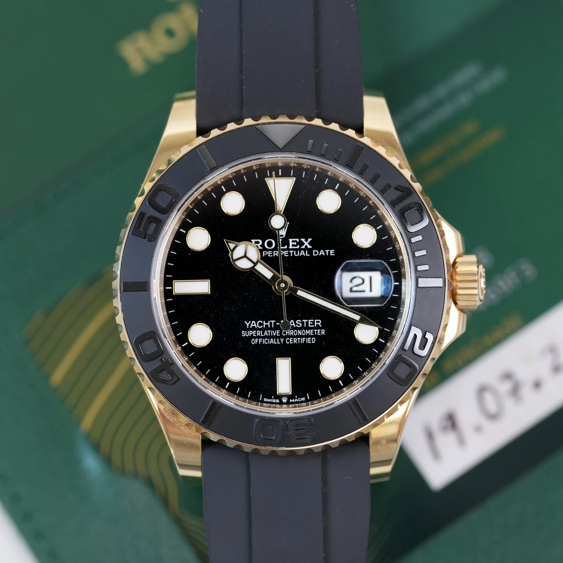 May be an image of wrist watch and text that says 'Ho1 RO ROLEX EX PERPETUAL ETUAL DATE PER 21 YACHT-ASTER YACHT ASTER SUPERLATIVE CHRONOMETER ETER TE CFFICIALLY OEFICIALL CERTIFIE…