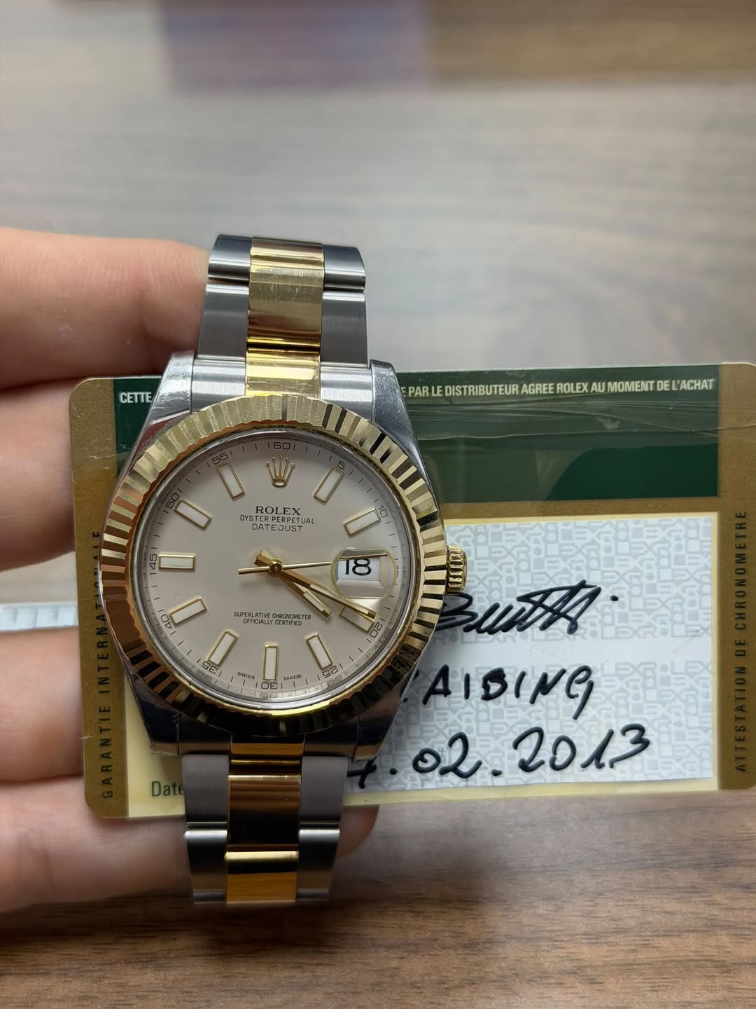 May be an image of wrist watch and text