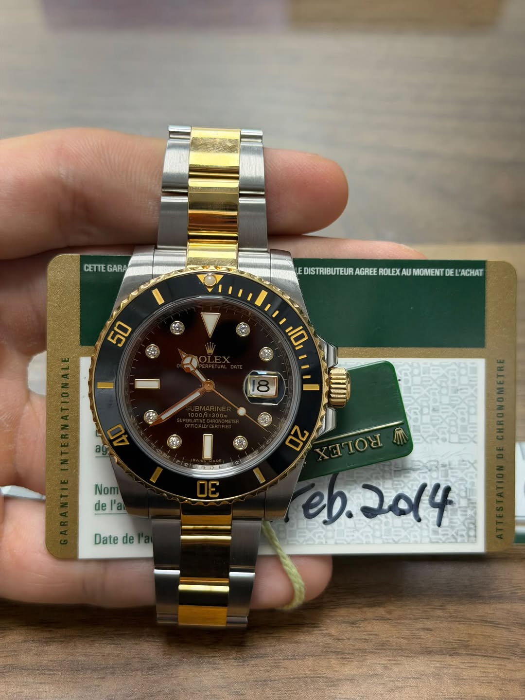May be an image of wrist watch and text