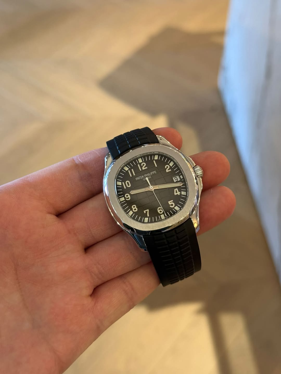 May be an image of wrist watch and text