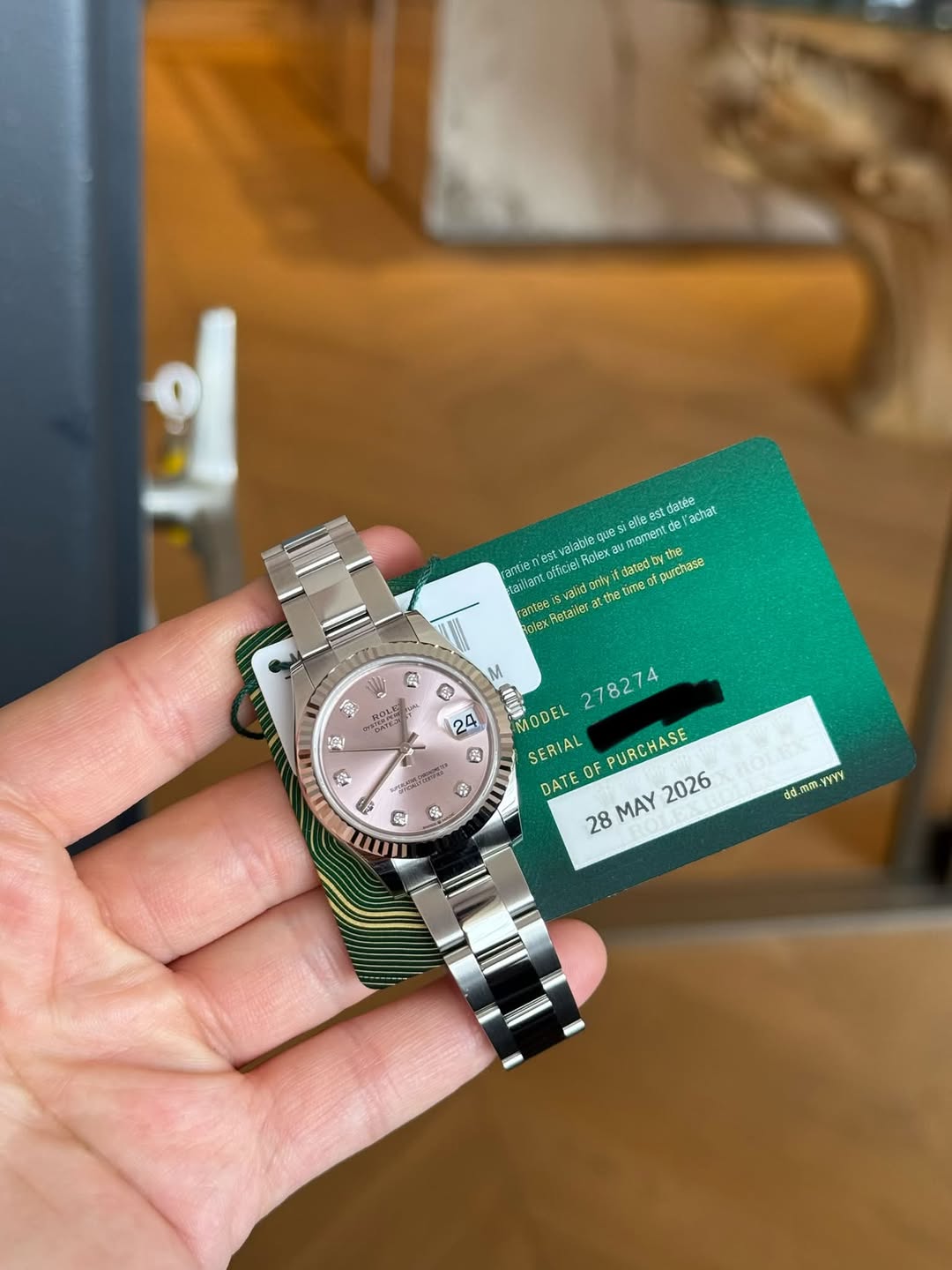 May be an image of wrist watch and text