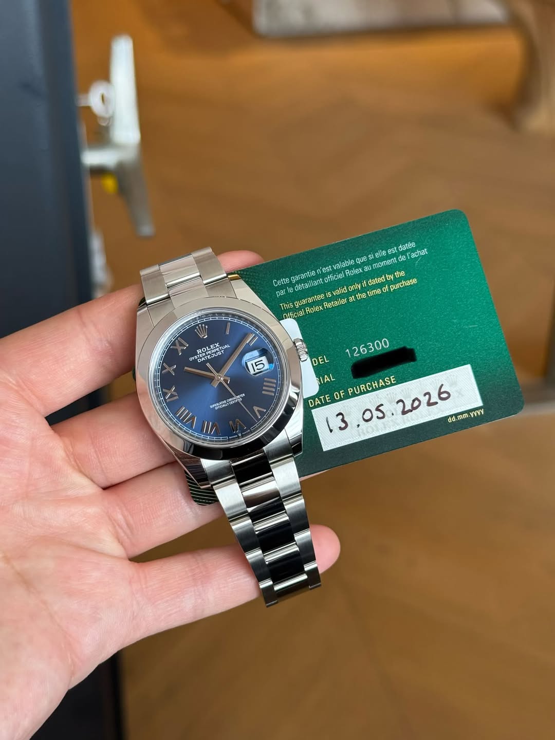 May be an image of wrist watch and text