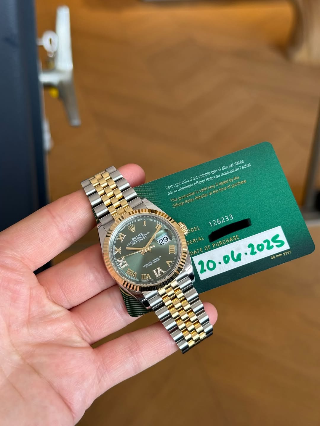 May be an image of wrist watch and text