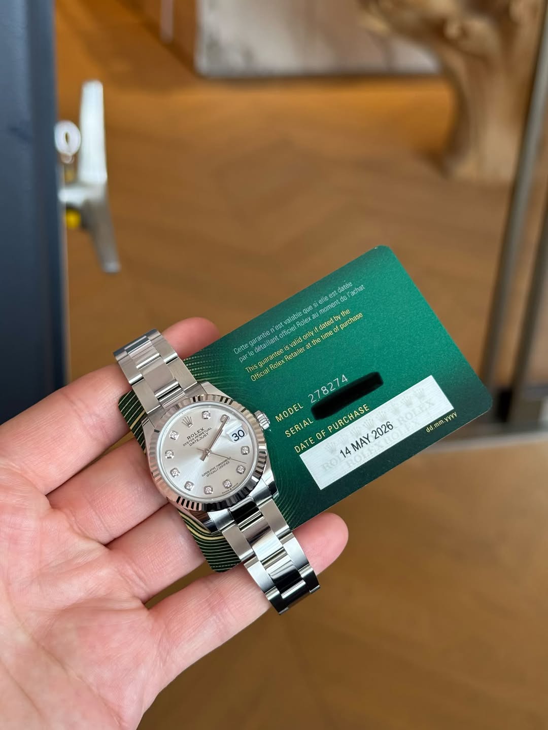 May be an image of wrist watch and text