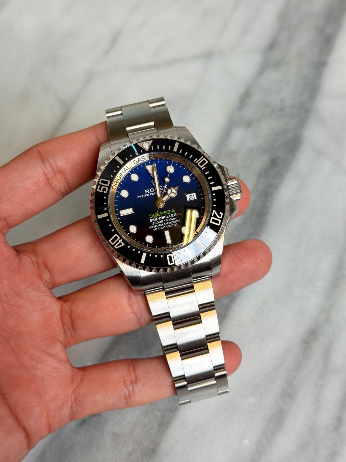 May be an image of wrist watch and text