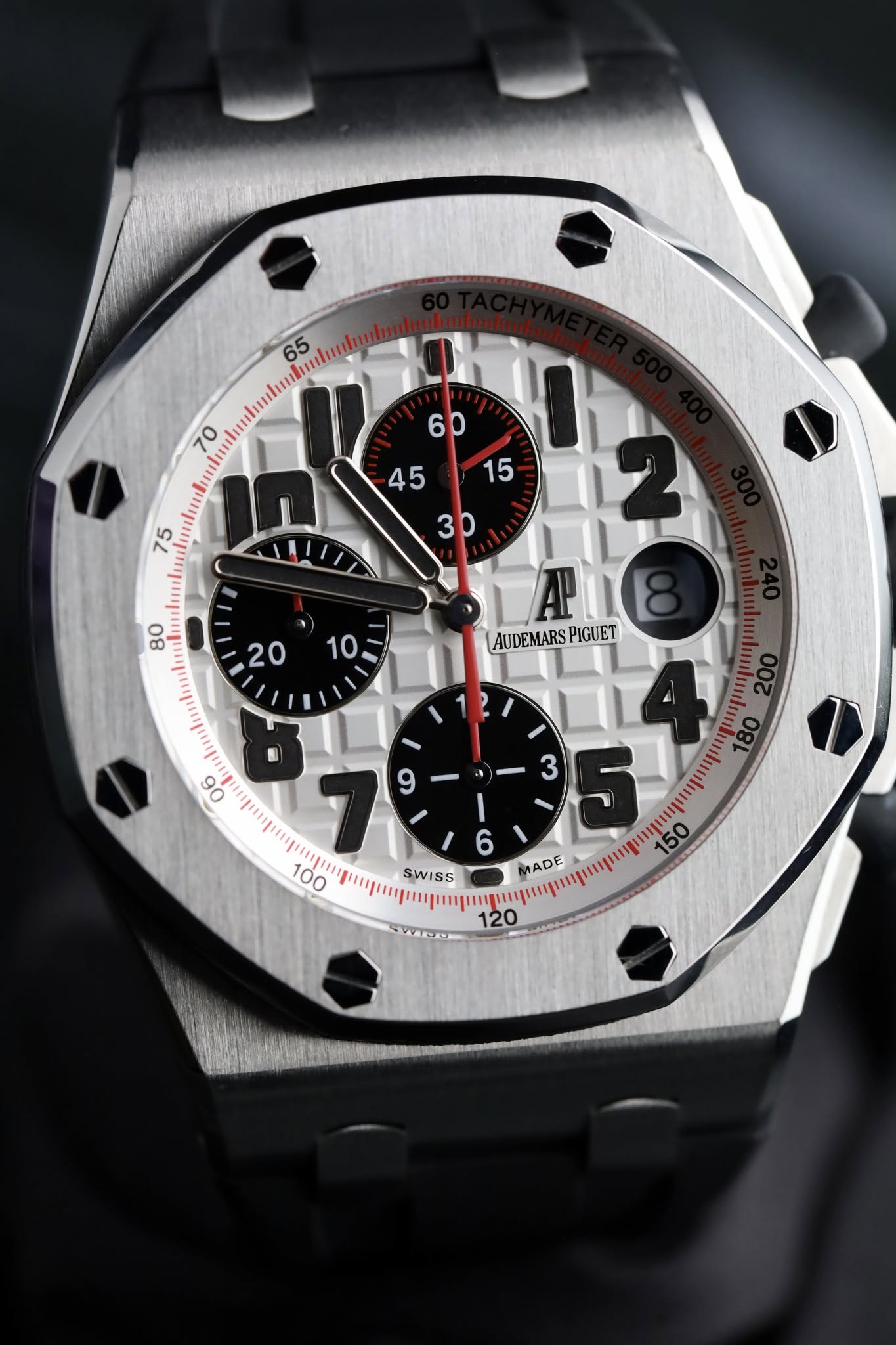 May be an image of wrist watch and text