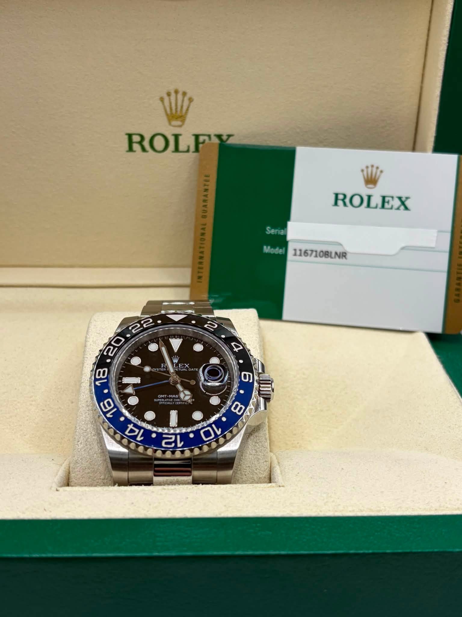 May be an image of wrist watch and text that says 'ROLFV ROLEX Model 116710BLNR '