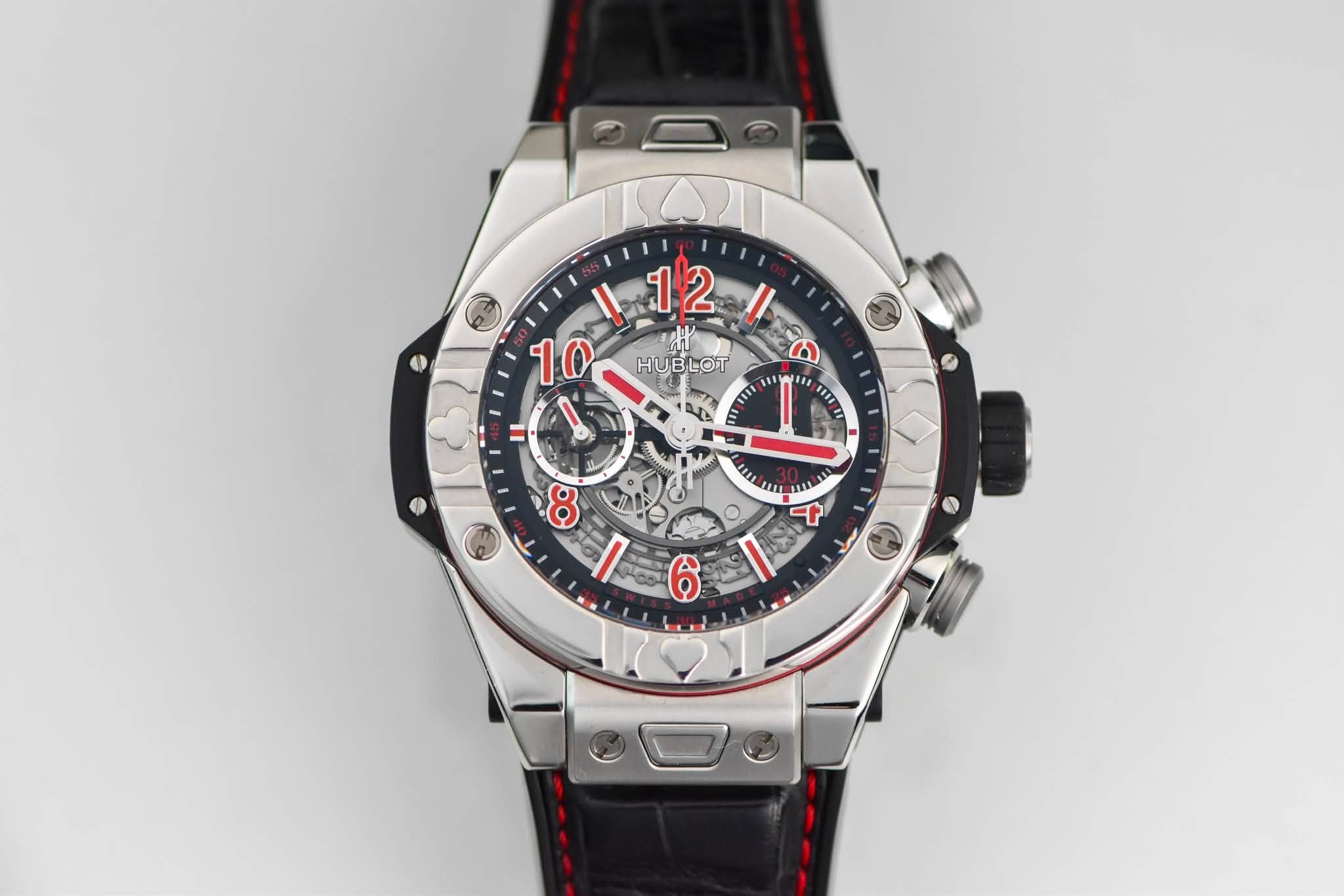 May be an image of wrist watch and text that says '12 HU HUBLOT 10 C הו 1 11E M S1E1 خکه 1U UIL U I ት 80 gi'