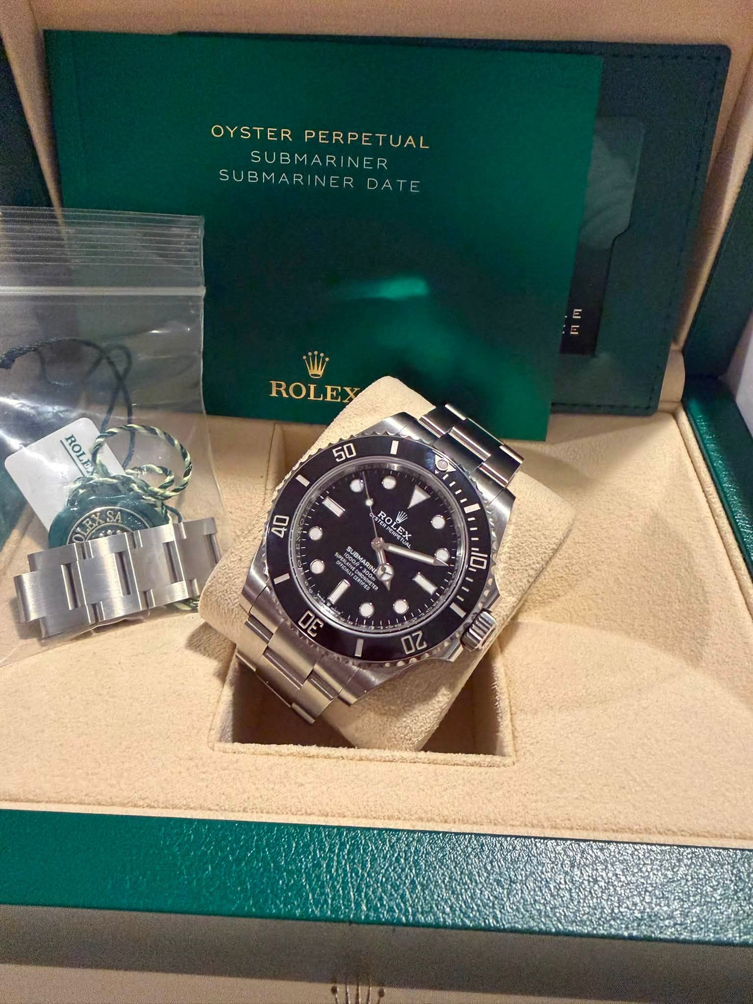 May be an image of wrist watch and text that says 'OYSTER YSTERPERPETUAL PERPETUAL SUBMAR SUBMARINER NE R SUBMARINERDAT SUBMARII INERDATE DATE 日門 ROLEX ROLE 50 I LEXSA O 40 ROL…