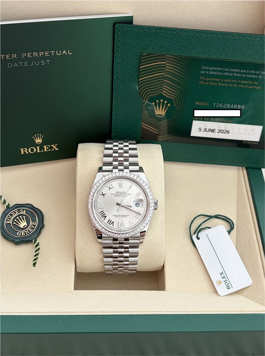 May be an image of wrist watch and text that says 'TER PERPETUAL DATEJUST EJUST 26284RBR RBR ROLEX 5JUNE2026 5 JUNE 2026 XI .NOLEX ROLEX SDINONU DATEJUT ARA OLEX U SA GED 6 עודה…