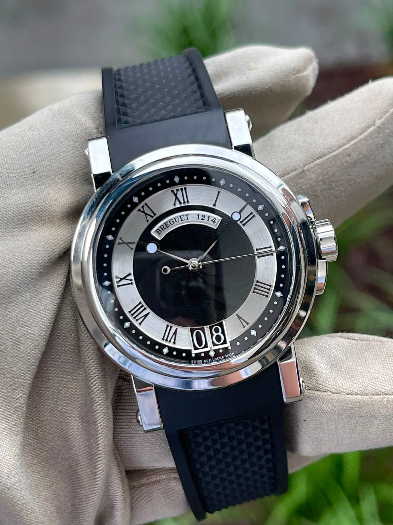 May be an image of wrist watch and text