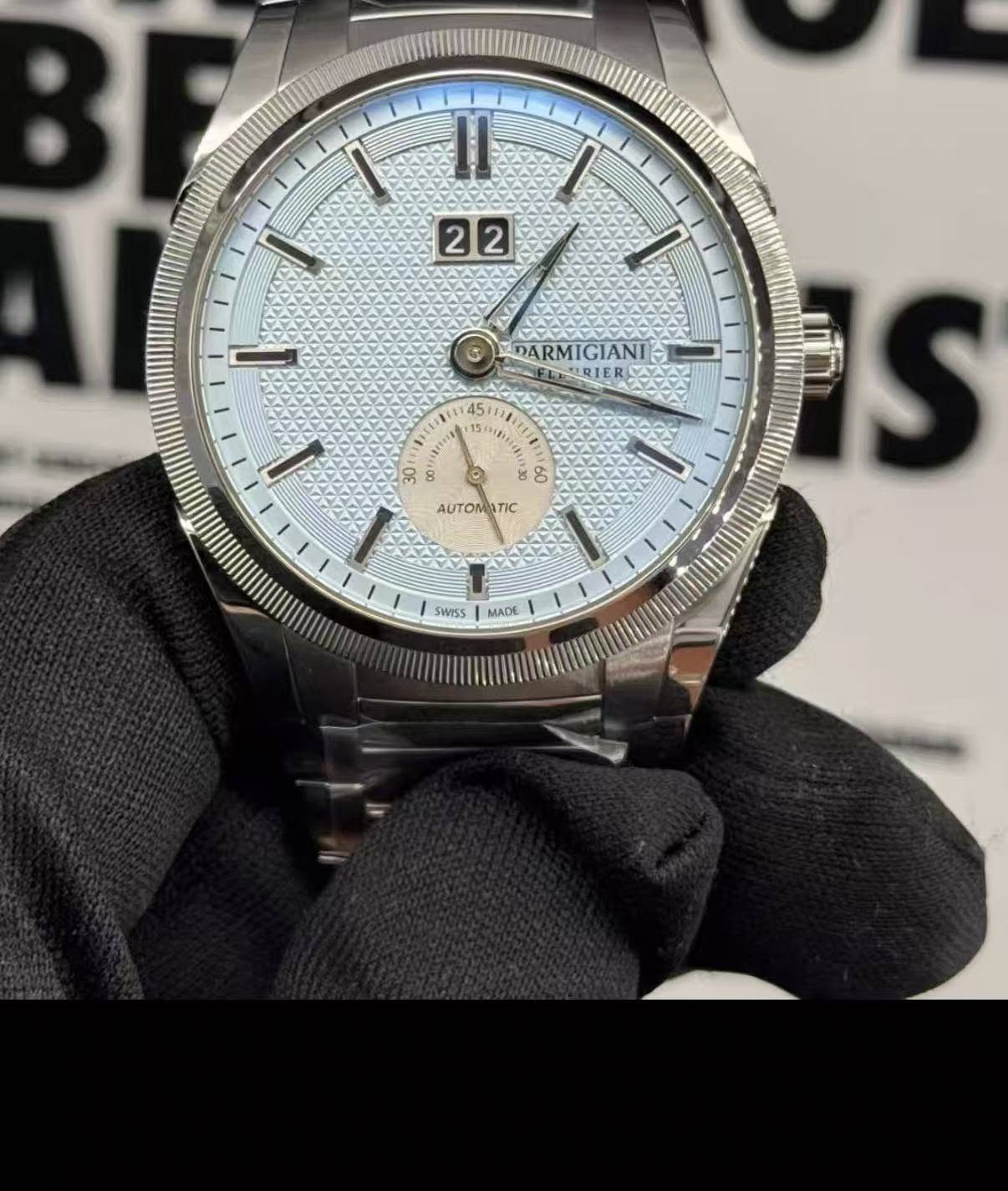 May be an image of wrist watch and text that says 'シャム 22 MNN DAR DARMIGIANI IGIANI SRIER 45 T Se ه AUTOMATIC TIC AUTO حب 005 WI55 MADE IS'