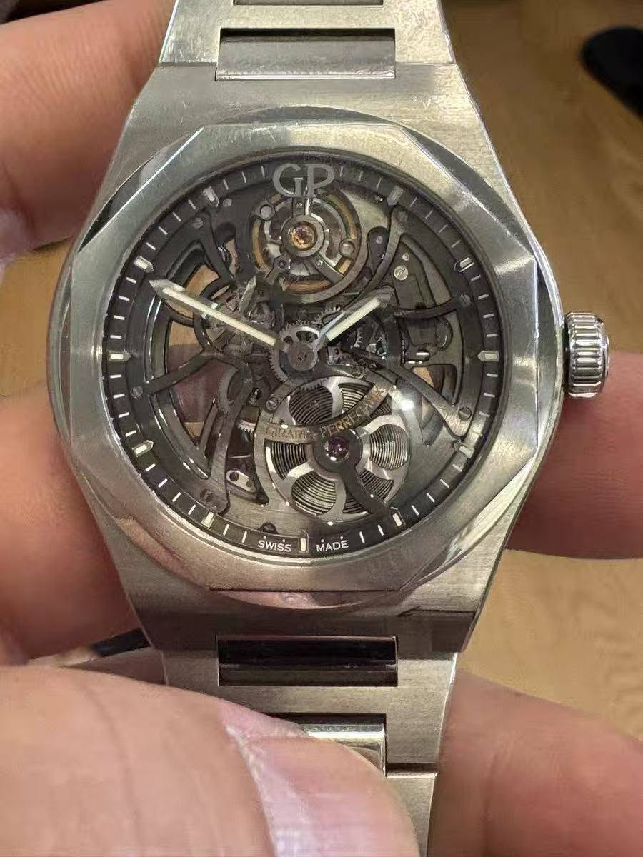 May be an image of wrist watch and text