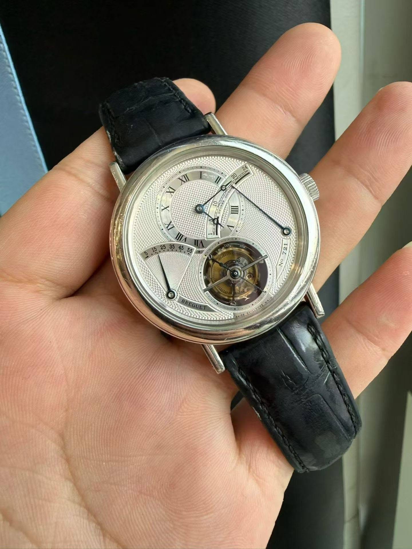 May be an image of wrist watch