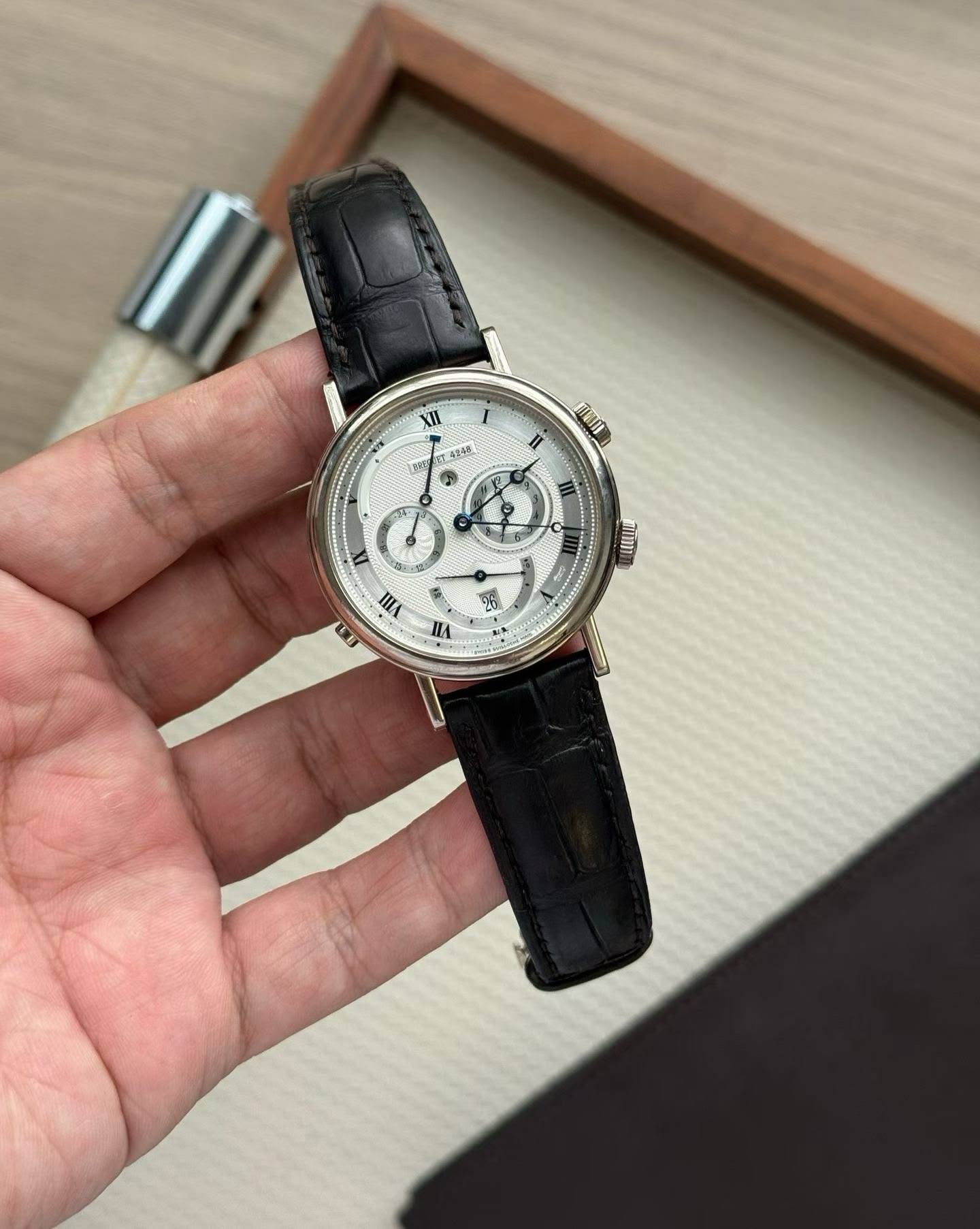 May be an image of wrist watch and text