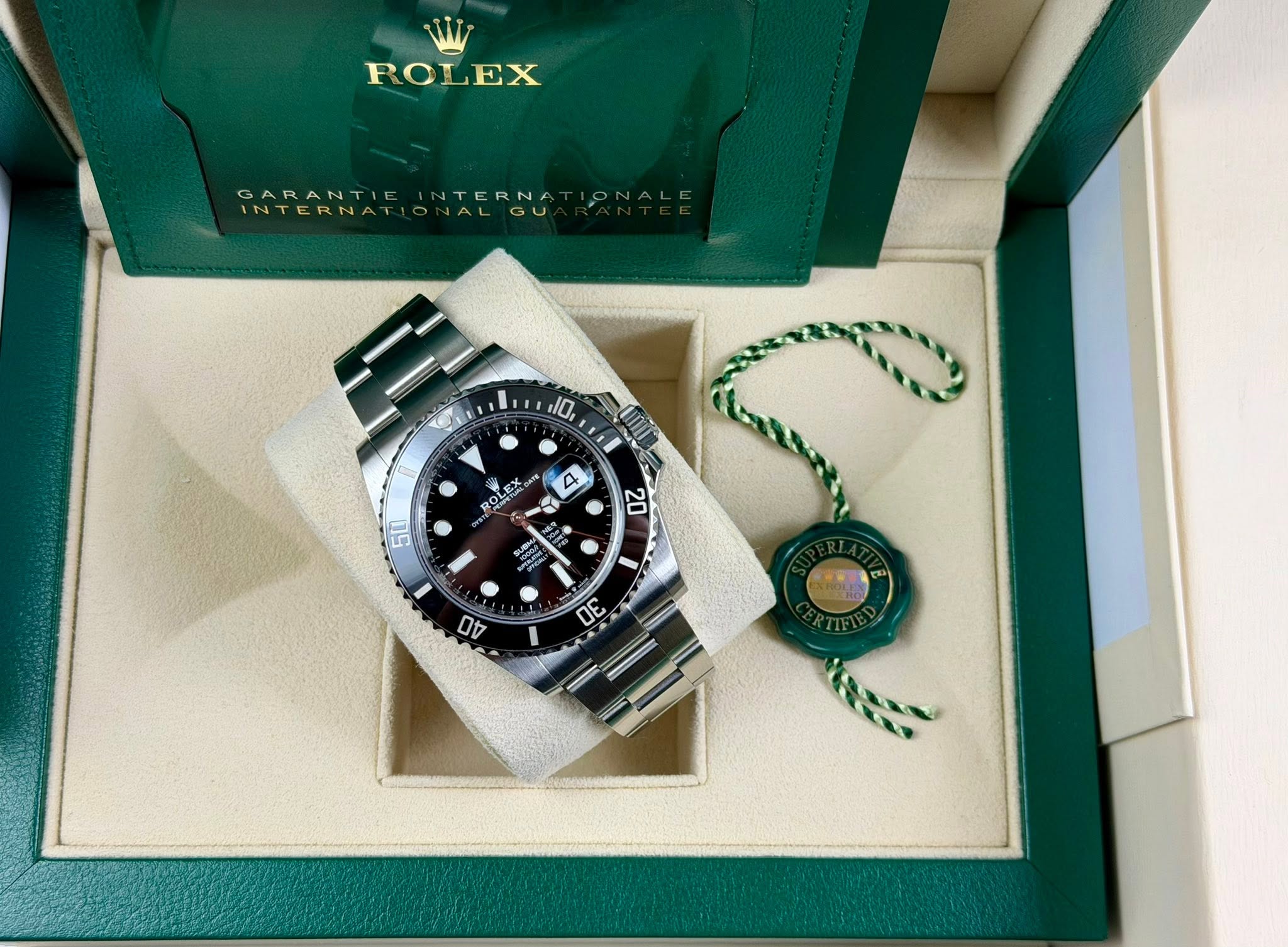 May be an image of wrist watch and text that says 'ROLEX EX ROI GARANTI TERNA 10 A ROLEX RO و 500 20 ต D0'