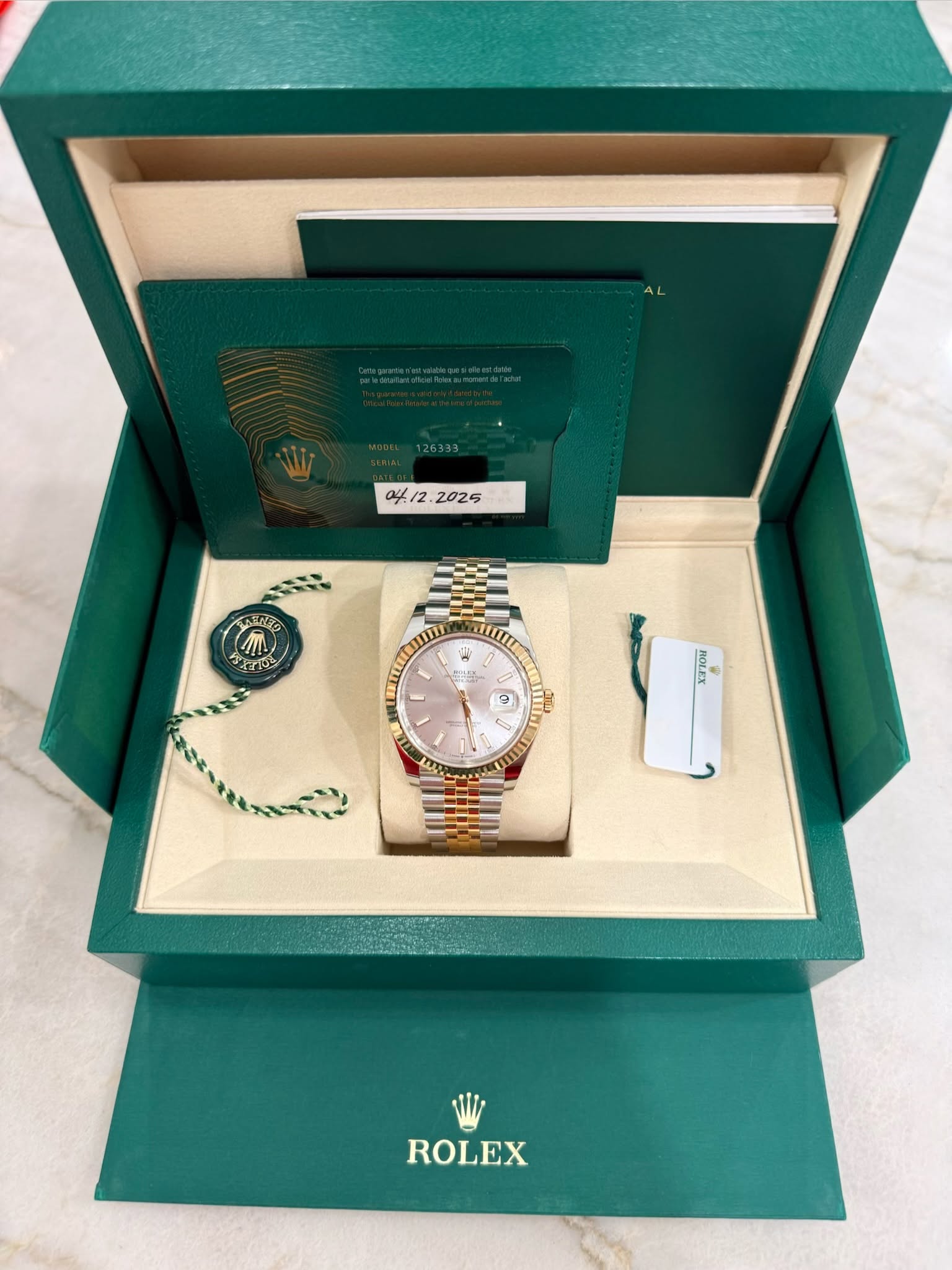 May be an image of wrist watch and text