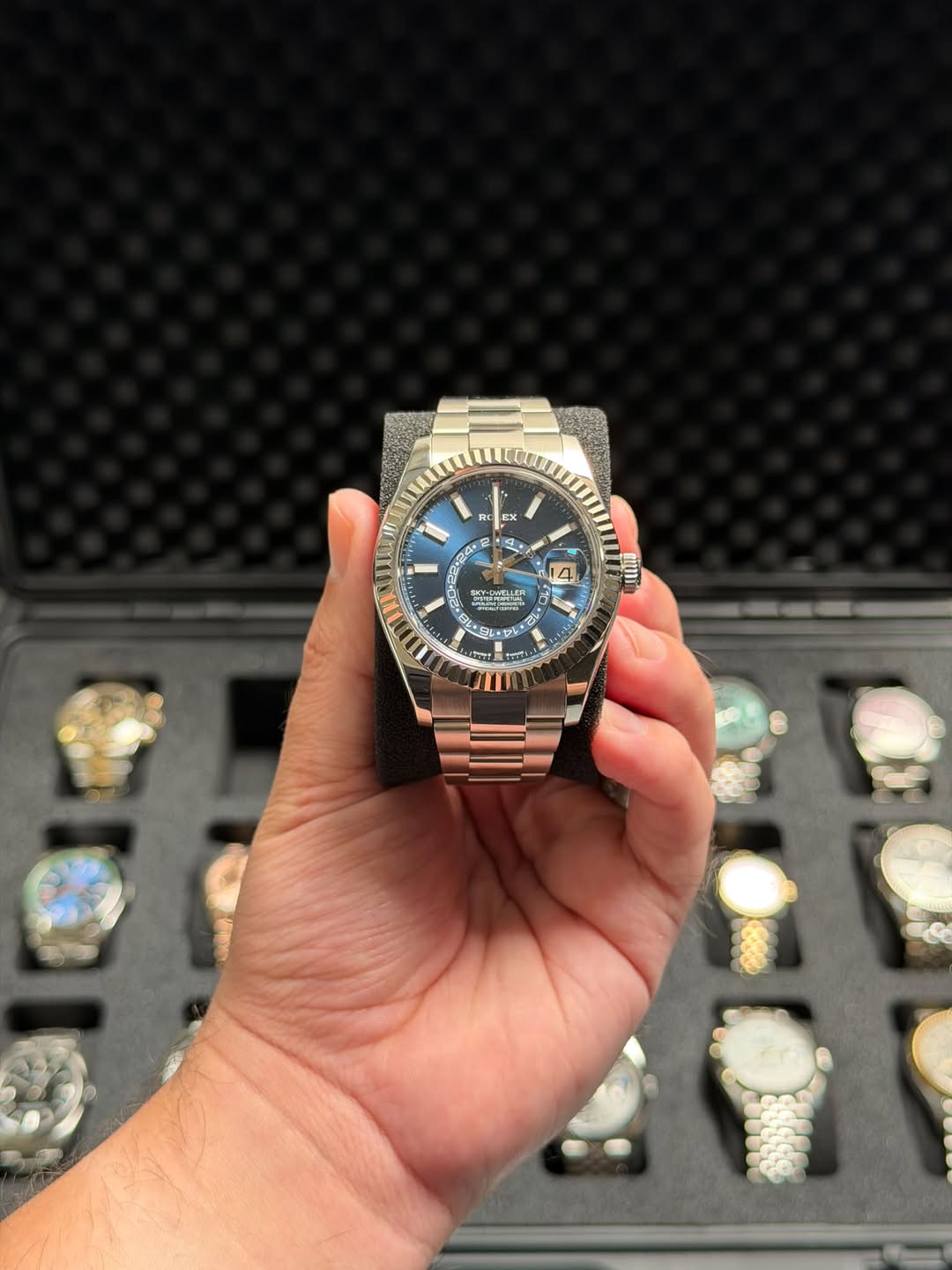May be an image of wrist watch and text