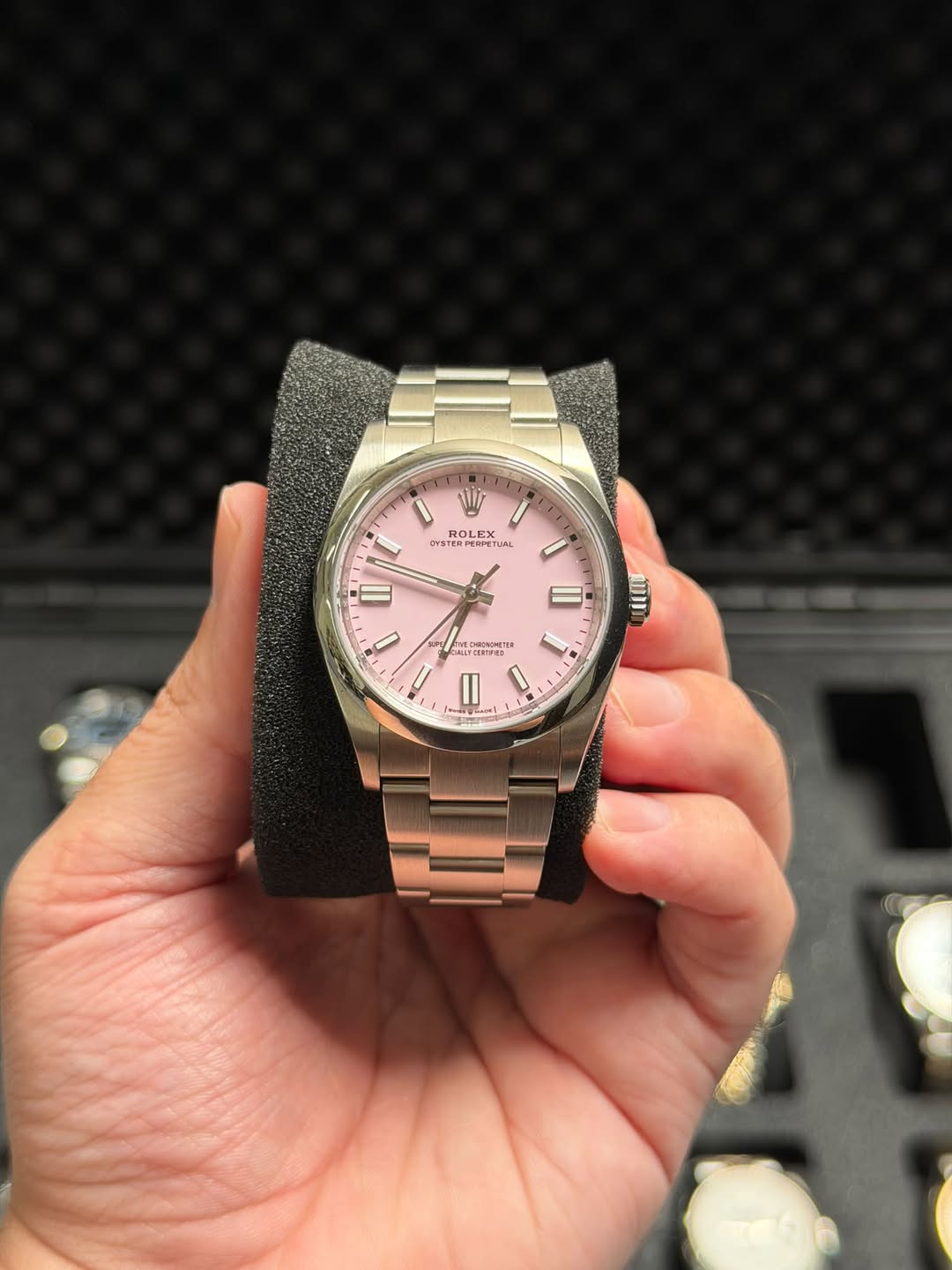 May be an image of wrist watch and text