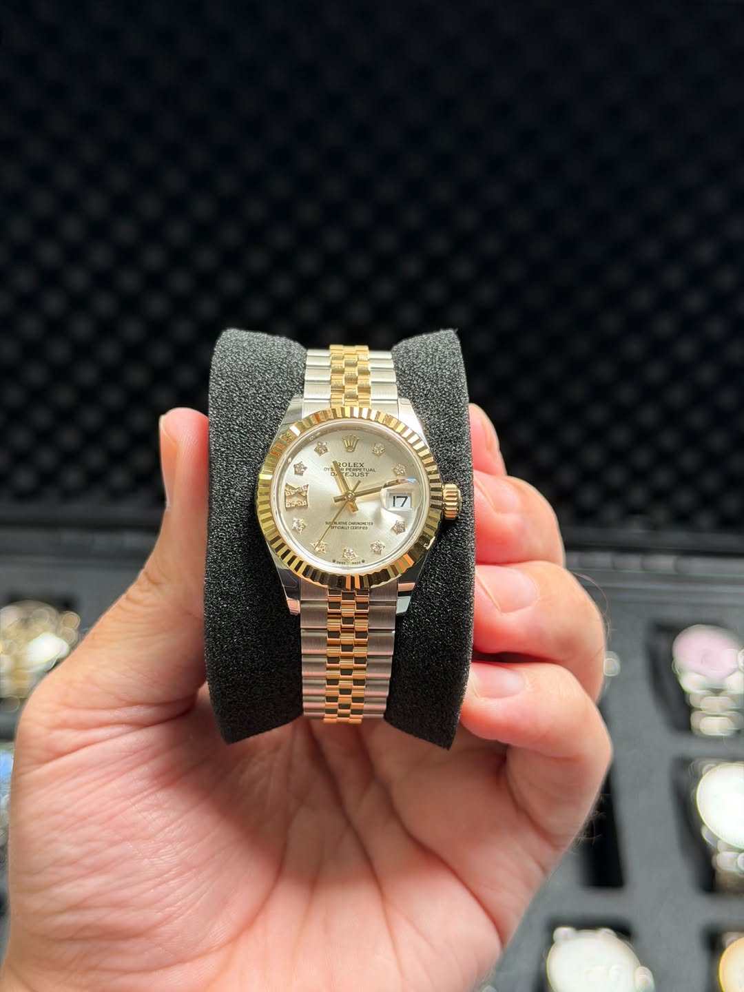May be an image of wrist watch and text