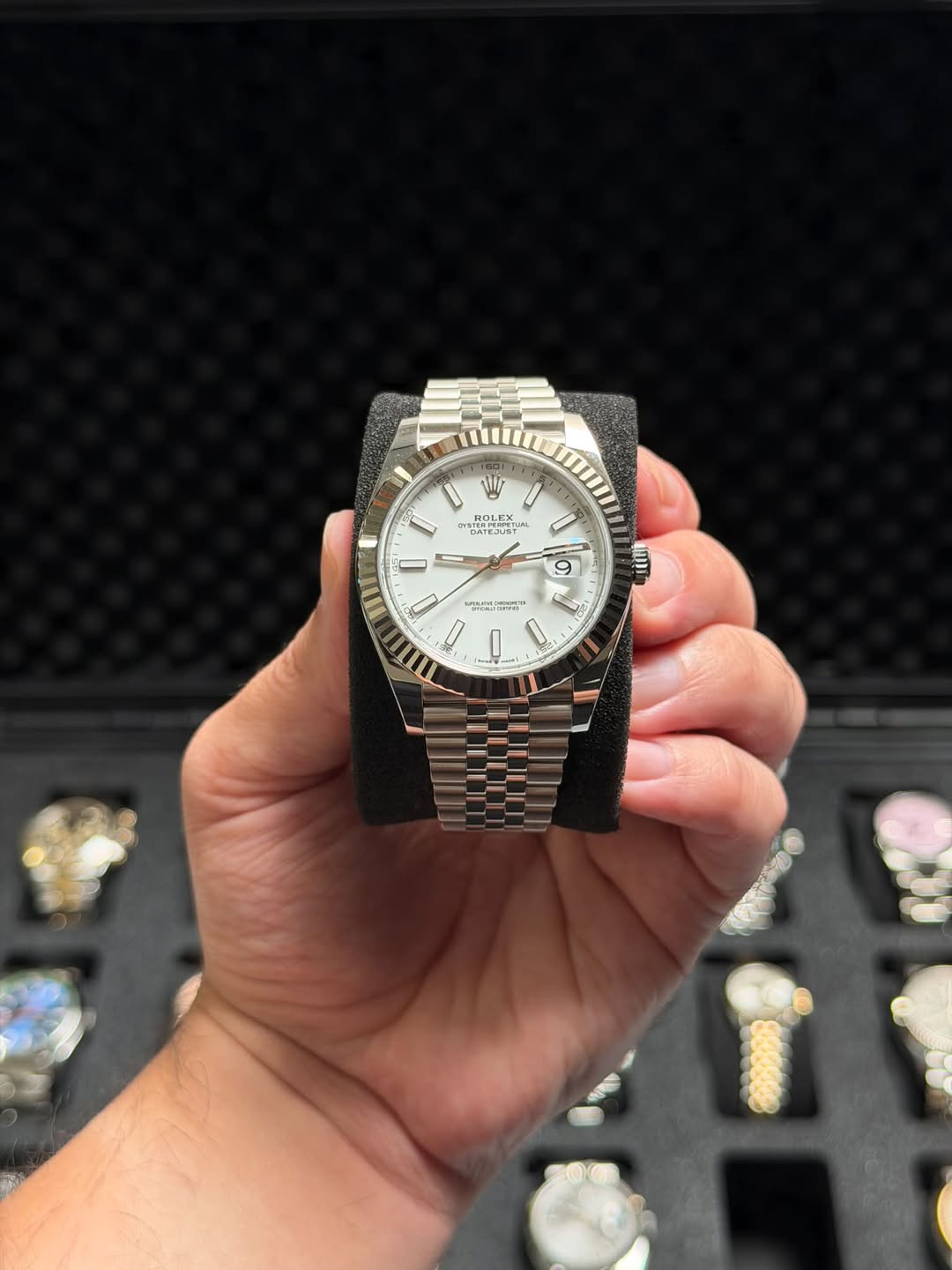 May be an image of wrist watch and text
