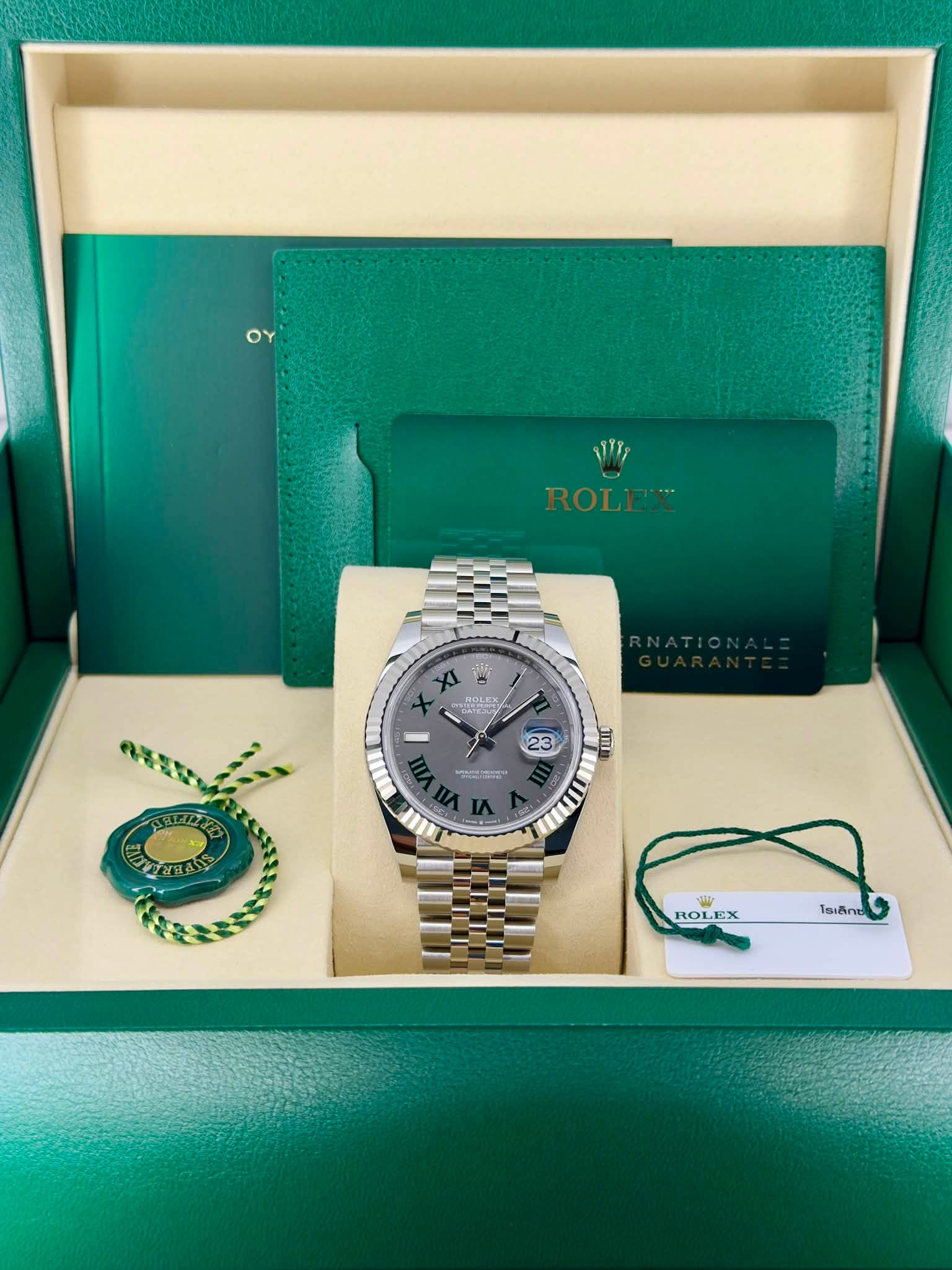May be an image of wrist watch and text