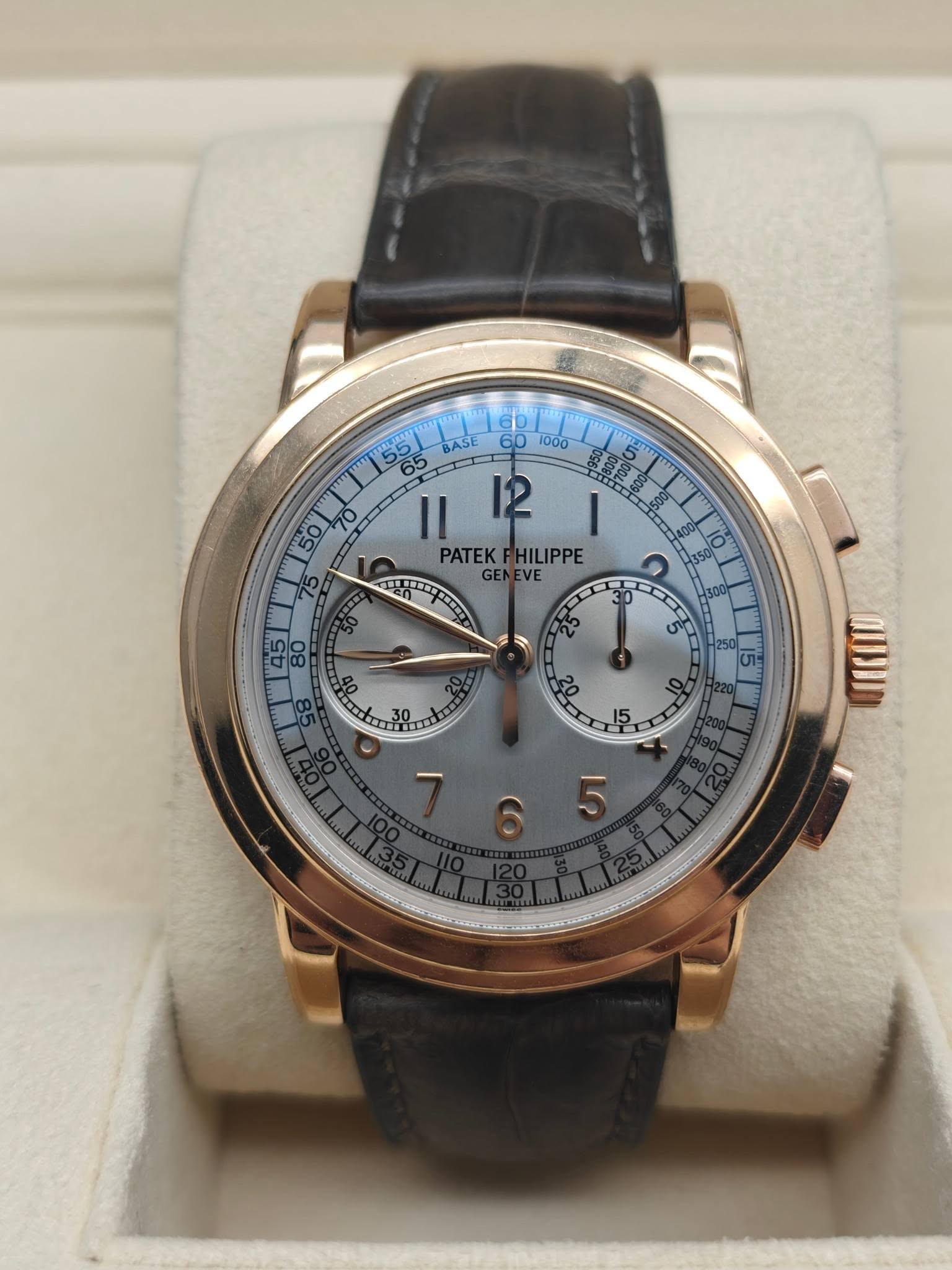 May be an image of wrist watch and text that says ' BASE 65 65 エニ工工 60 1000 I1 12 PATEK PATEKFHILIPPE HILIPPE TIIOT VEn Len GEN VE LA ריד 80 0 or لمه ហះ 10 15'
