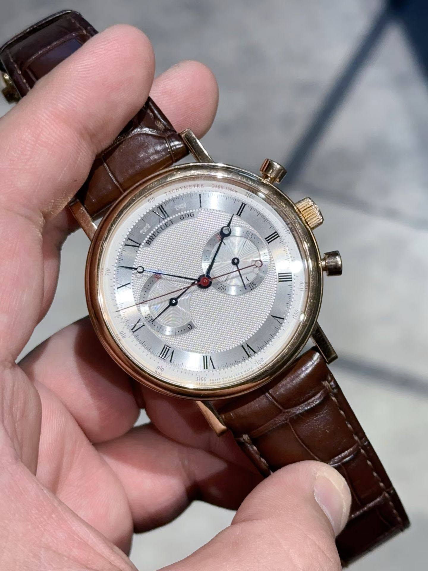 May be an image of wrist watch and text